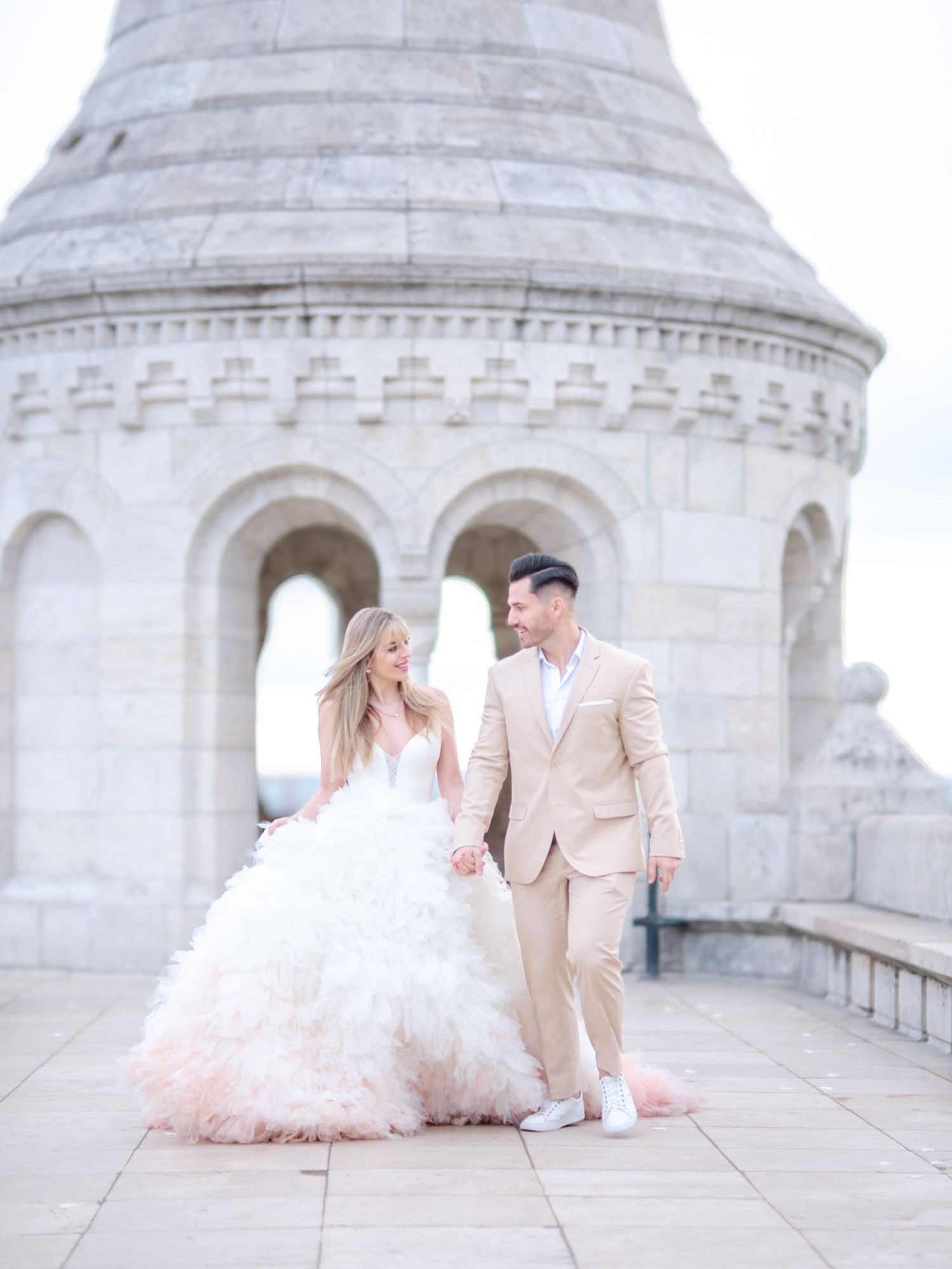 Graceful couple posing romantically at Fisherman’s Bastion during an elopement shoot, beautifully captured by Hang Pham Photography