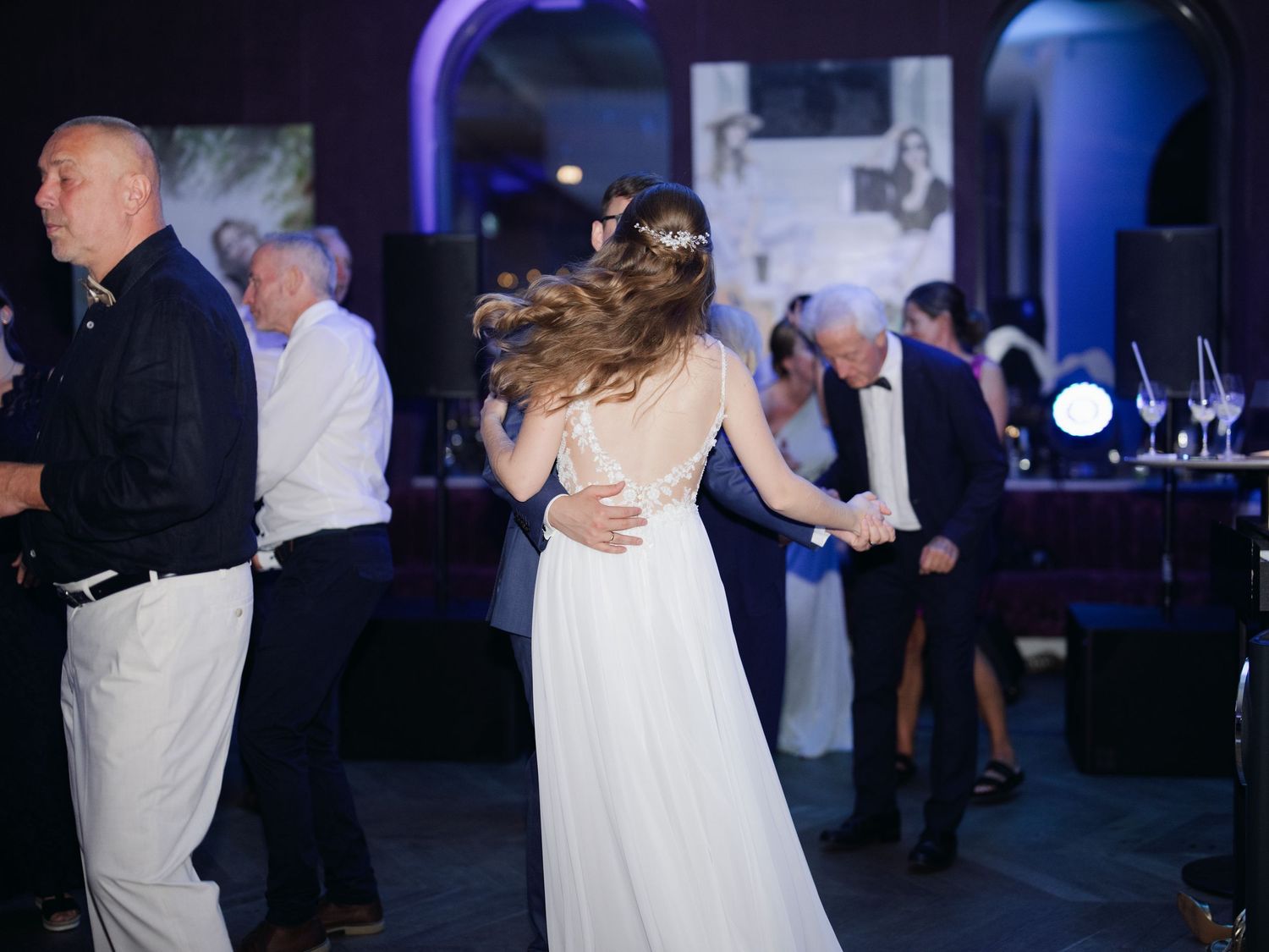 Vibrant party scene at an intimate destination wedding hosted at Aranybástya Restaurant in Budapest, capturing joyful celebration moments