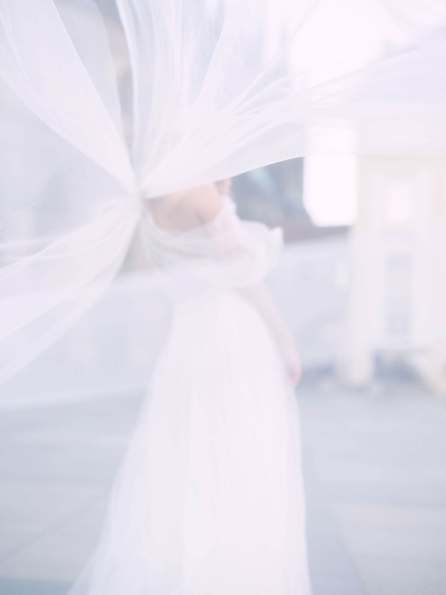Dynamic bride in a Kozarics Viktor dress posing at Prague Castle for a destination wedding, beautifully captured by Hang Pham Photography