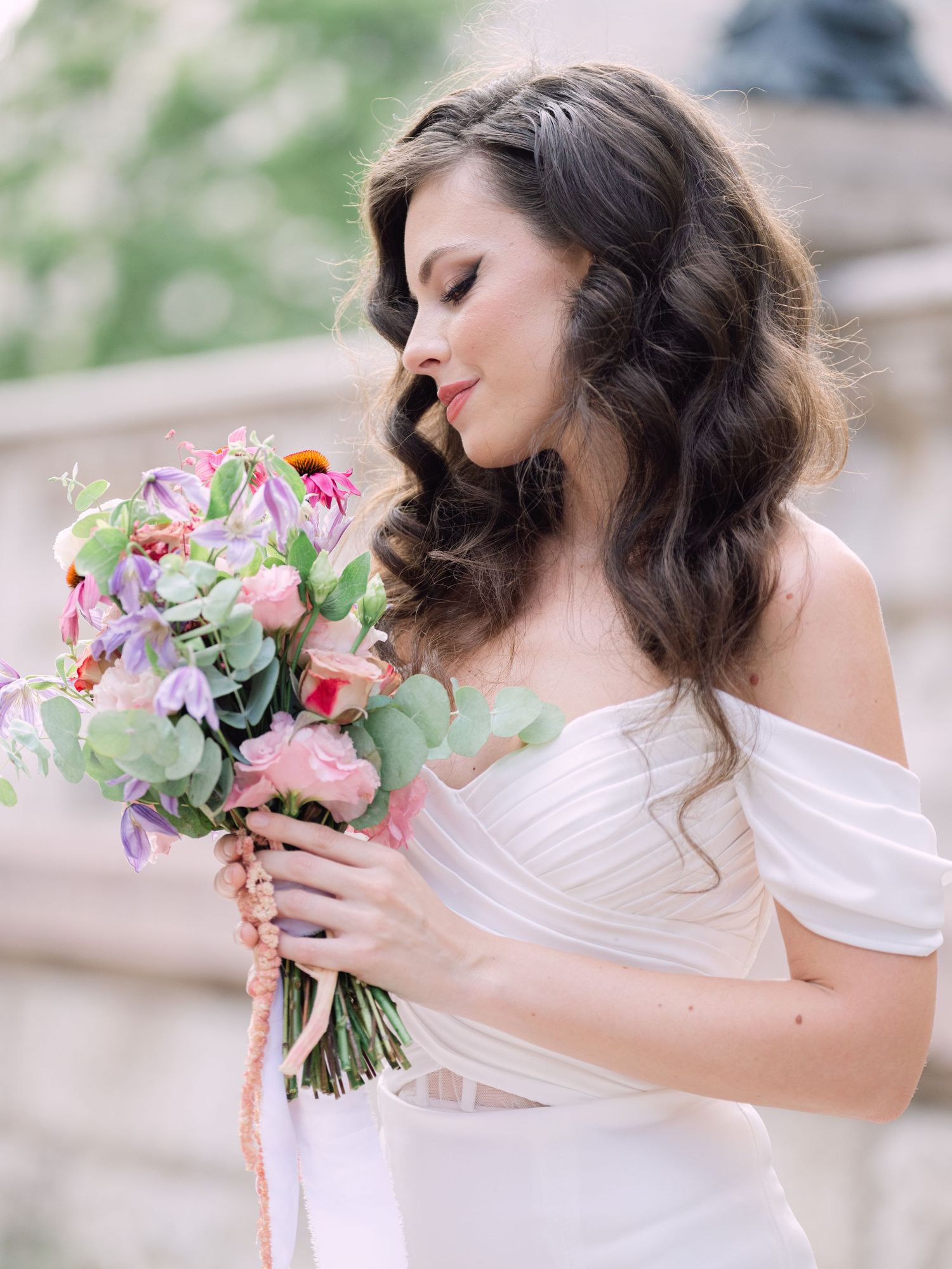 Captivating bride in a Leya Couture dress posing near St. Peter’s Basilica in Budapest for a wedding editorial by Hang Pham Photography