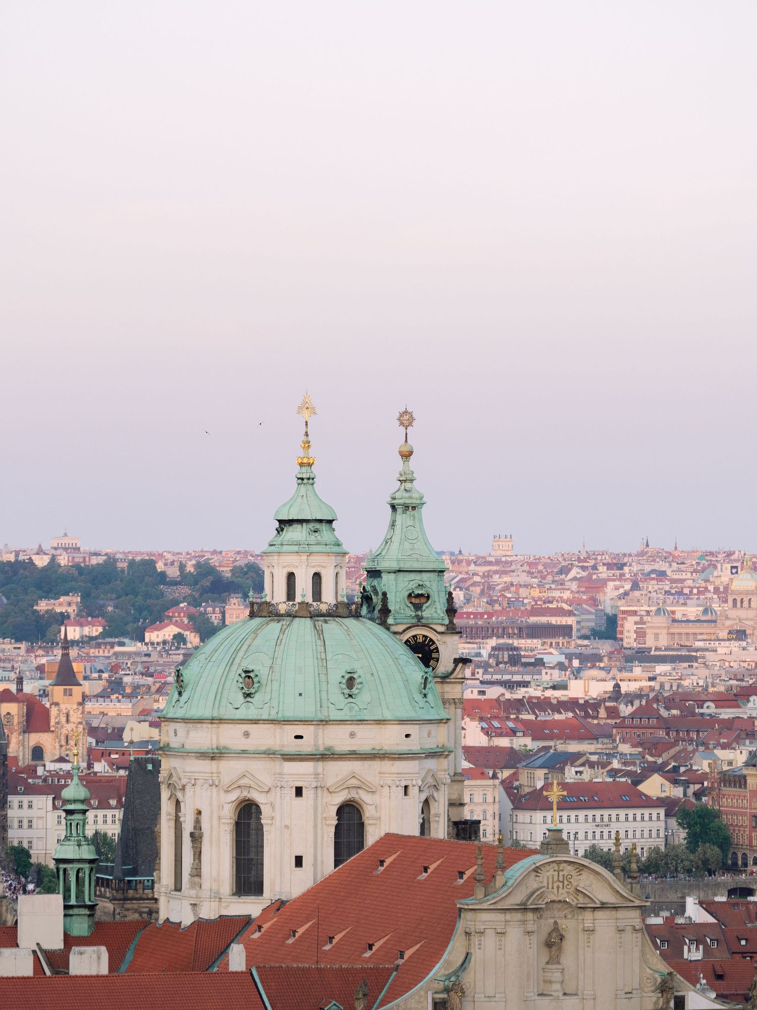 Scenic sunset view from Prague Castle overlooking the city, captured during a luxury destination wedding for an unforgettable moment