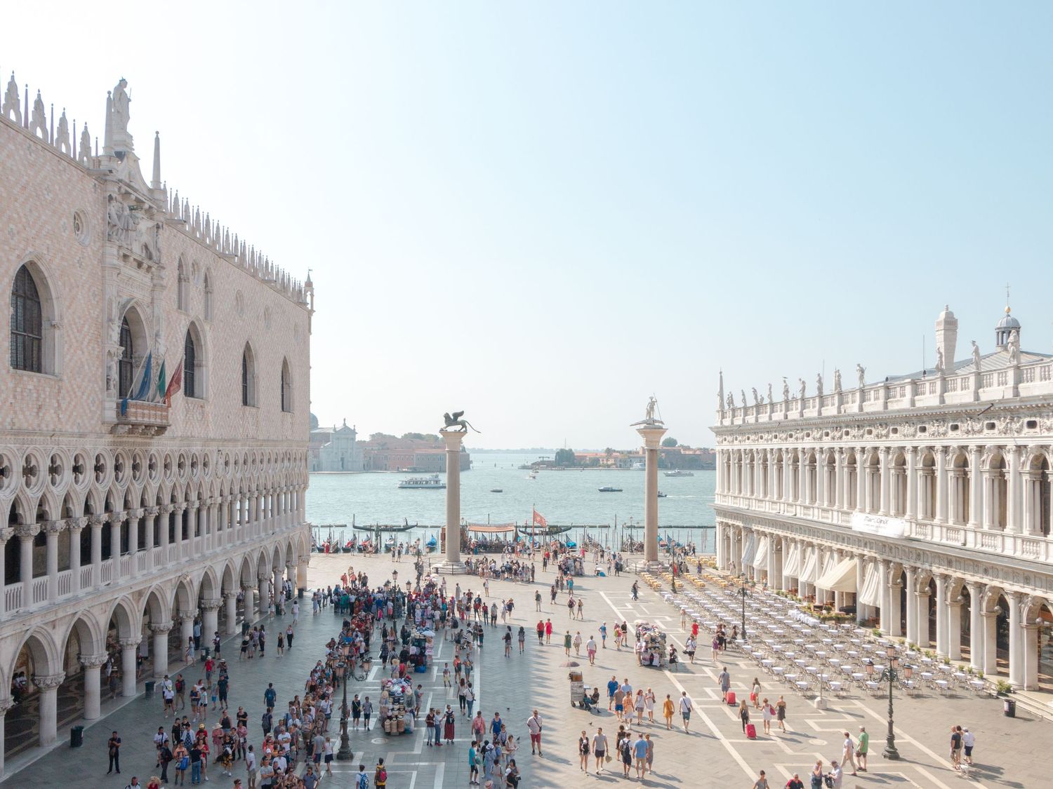 Piazza San Marco bustling with summer crowds, a romantic wedding destination location ideal for timeless celebrations in Venice