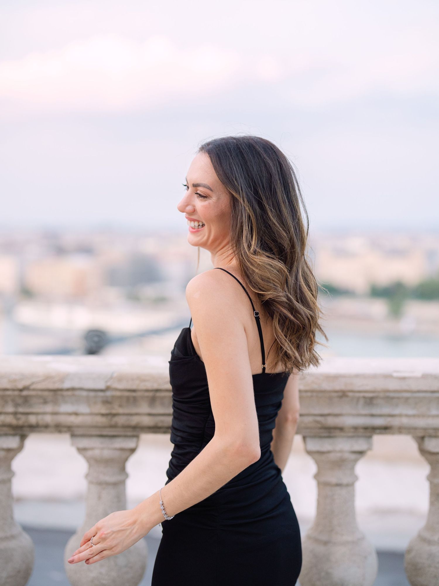 Elegant female posing around Buda Castle in Budapest during a chic portrait session, beautifully captured by Hang Pham Photography