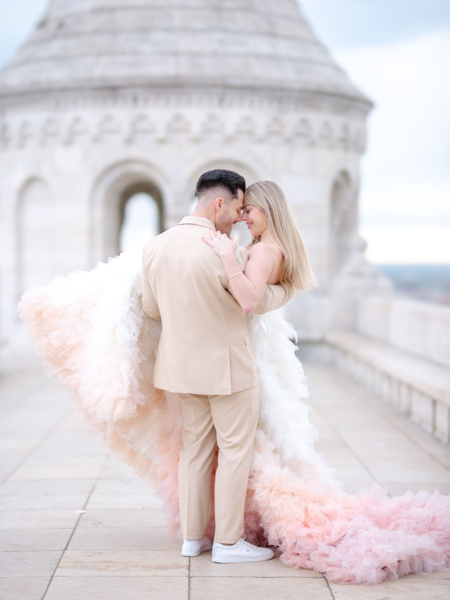 Graceful couple posing romantically at Fisherman’s Bastion during an elopement shoot, beautifully captured by Hang Pham Photography
