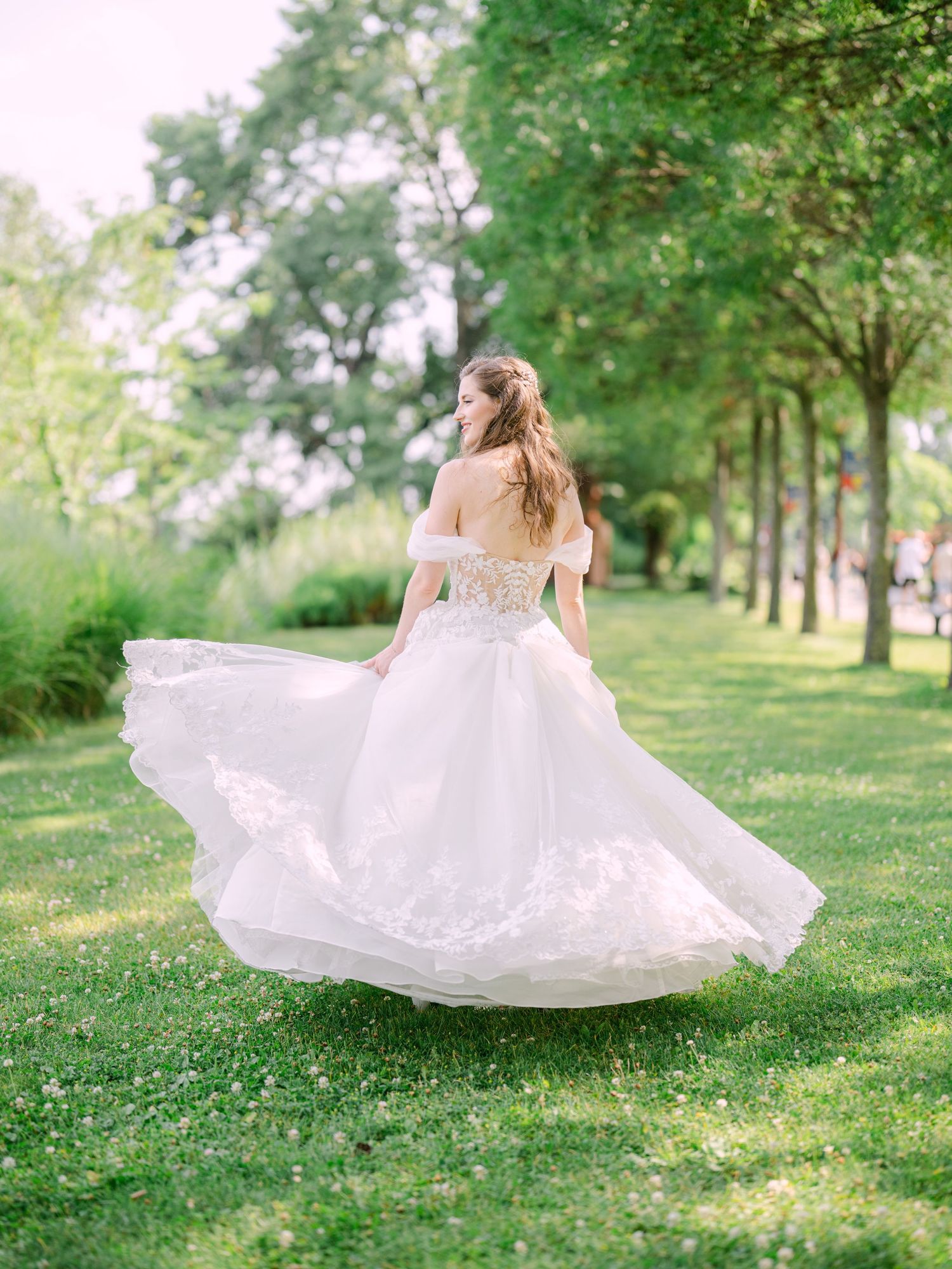 Cheerful bride posing at Kopaszi Gat in Budapest during a romantic pre-wedding session, beautifully captured in natural light by Hang Pham