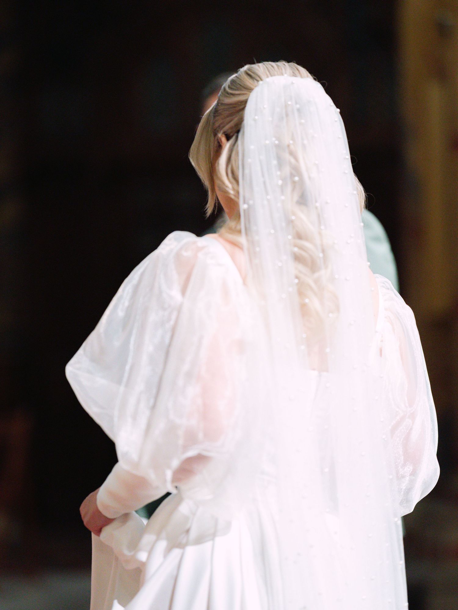 Bride and groom's first look and ceremony entry at St. Matthias Church in Budapest's Buda Castle during a luxury destination wedding