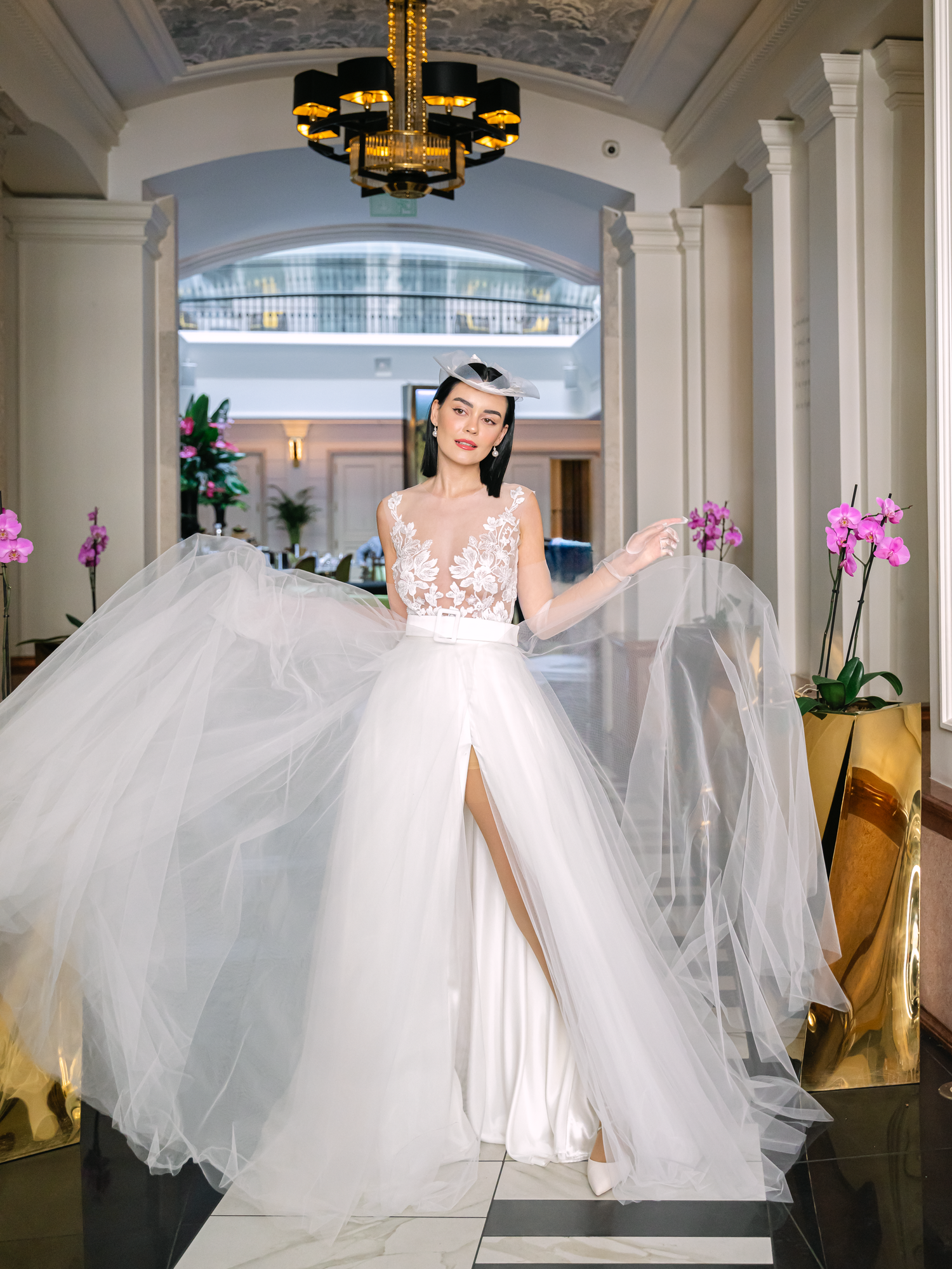 Elegant bride in a Nagy Agota wedding dress posing at Aria Hotel Budapest during a destination wedding, captured by Hang Pham Photography
