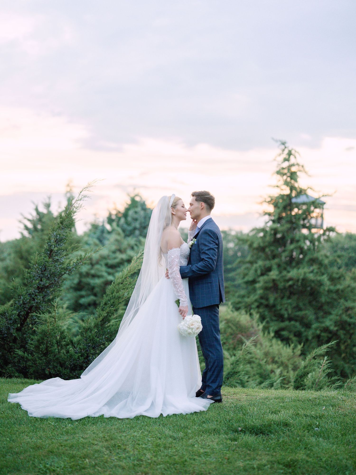 Captivating couple posing in Napkor during golden hour sunset for a wedding creative session, beautifully captured by Hang Pham Photography