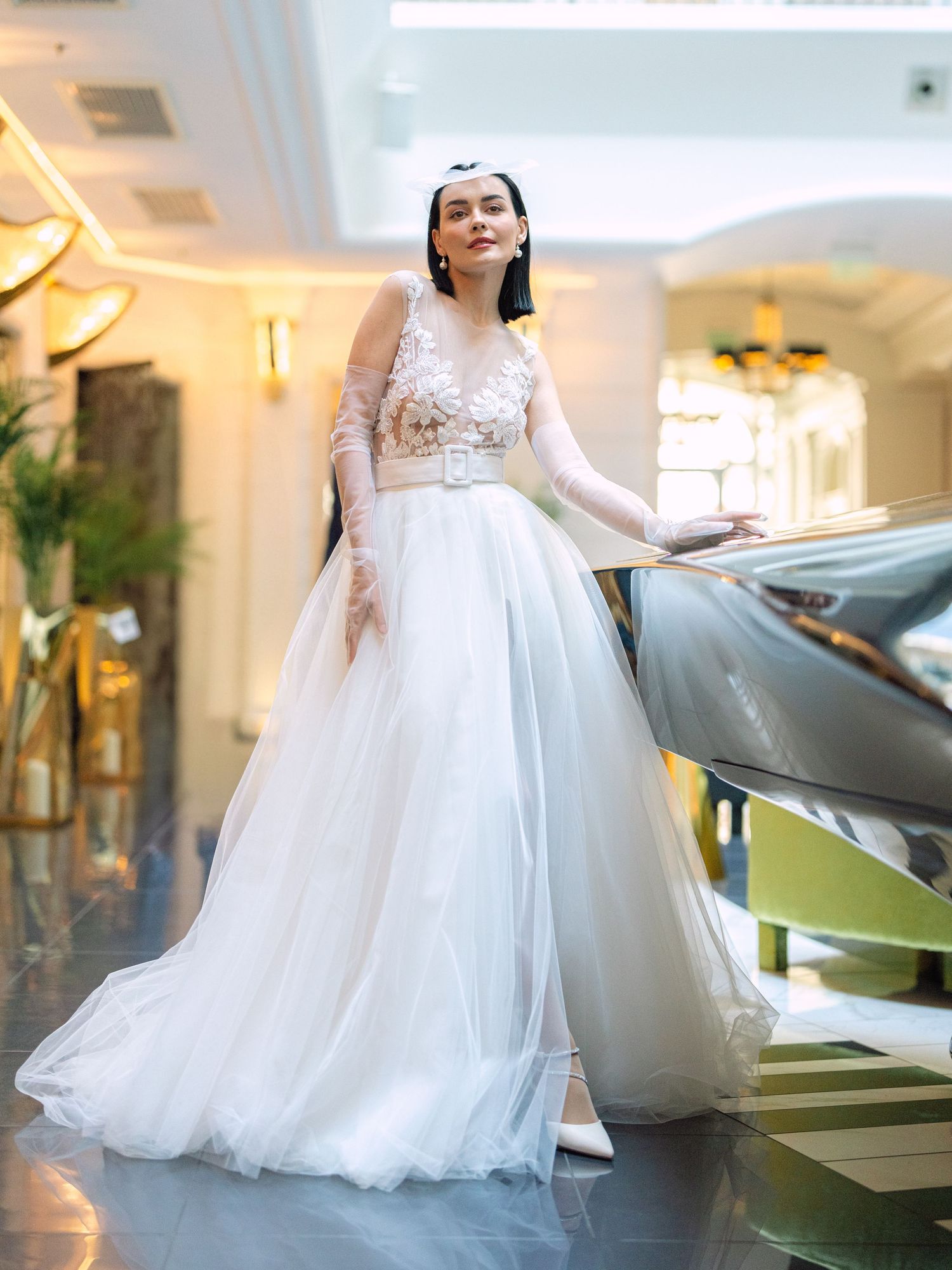 Elegant bride in a Nagy Agota wedding dress posing at Aria Hotel Budapest during a destination wedding, captured by Hang Pham Photography