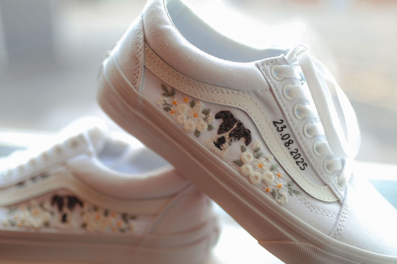 Custom white Vans sneakers with floral design and wedding date 23.04.2025 for bride.