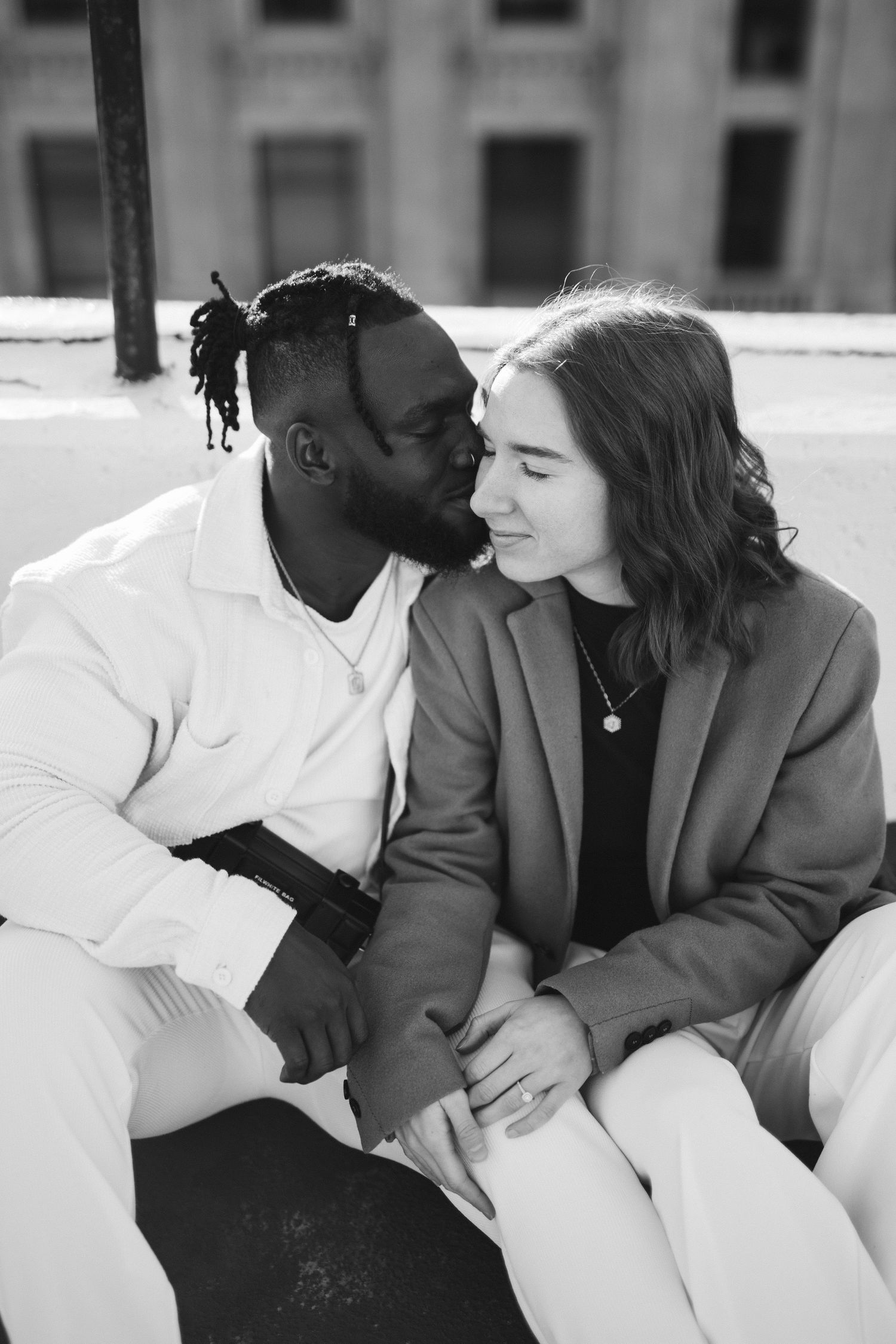 Black and white intimate portraits in casual white and grey attire.