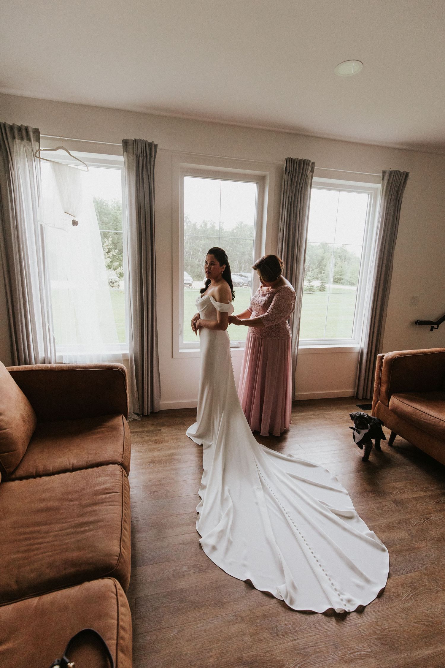 A sequence of wedding dress preparation photos showing elegant white gown details in a sunlit room with brown floors.