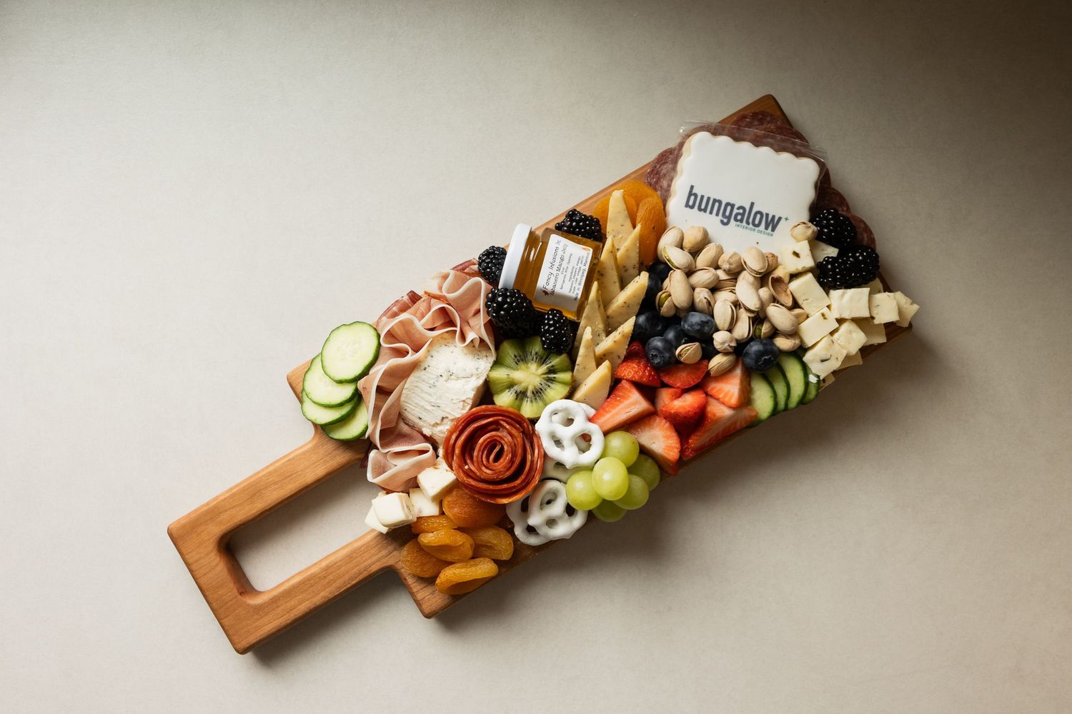 Beautifully arranged charcuterie board with assorted meats and snacks.