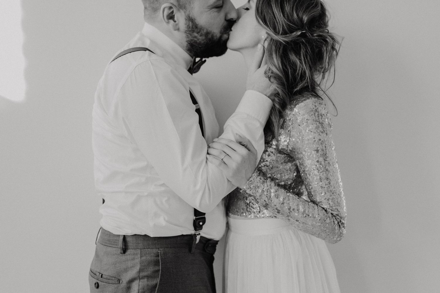 Romantic black and white photography of tender moments indoors.