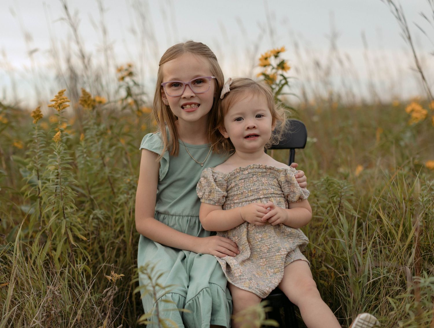 sisters in a wild flower field