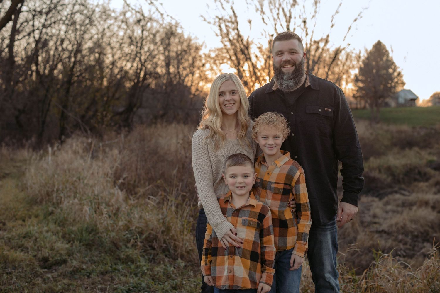family of 4 photos during the sun set