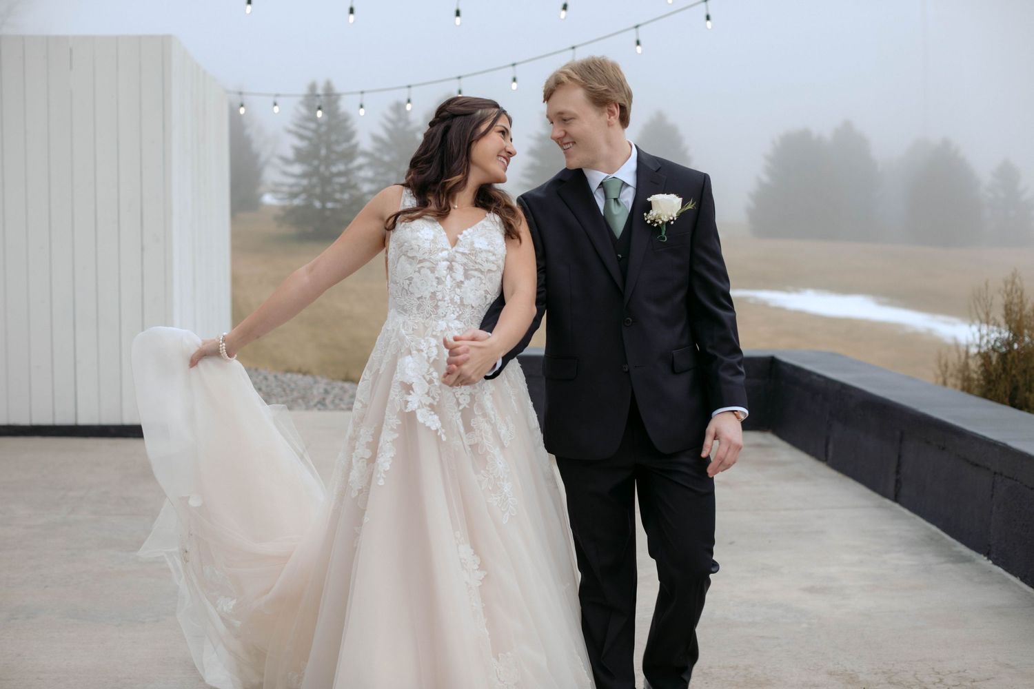 Woodhaven Weddings and Events in Cannon Falls Minnesota, bride and groom on a foggy evening with twinkle lights