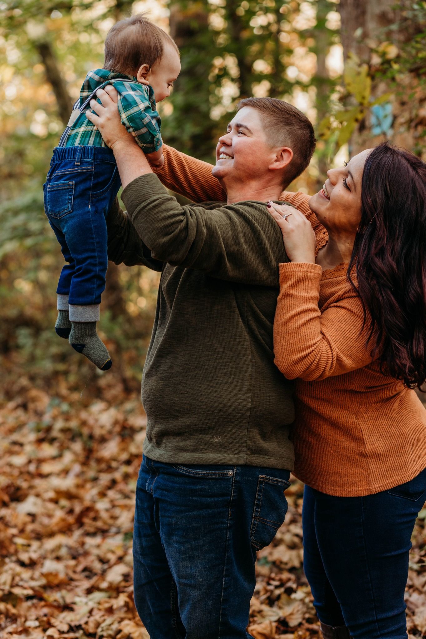 Playful family moments captured in autumn leaves with joyful expressions.