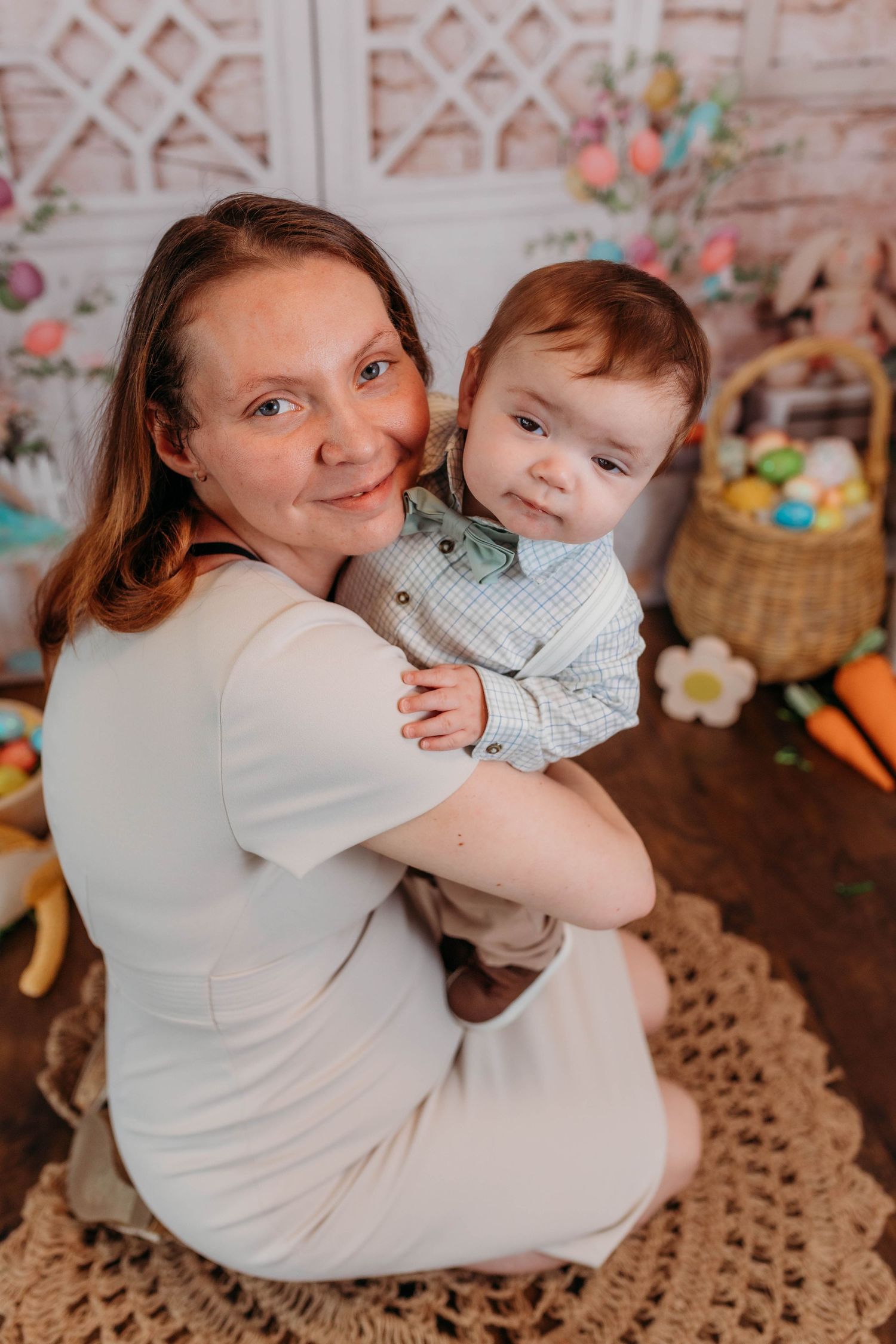 Easter holiday portrait with festive spring decorations and baskets in background.