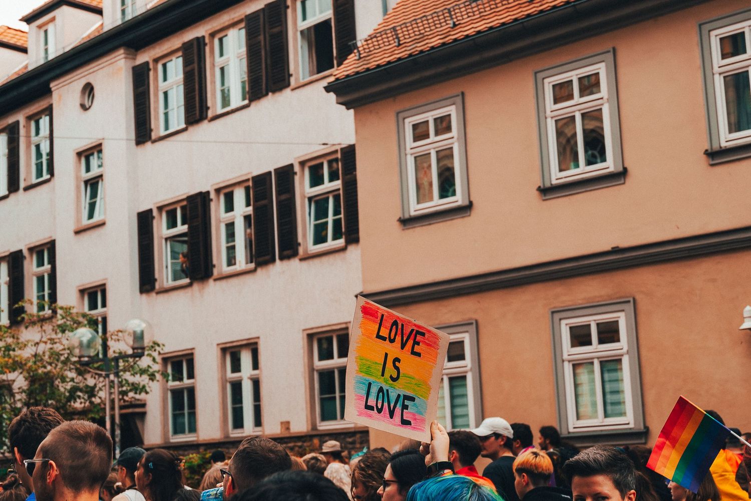 Protest scene at Erfurt. A group of demonstrators holding signs with messages about Queer Rights.