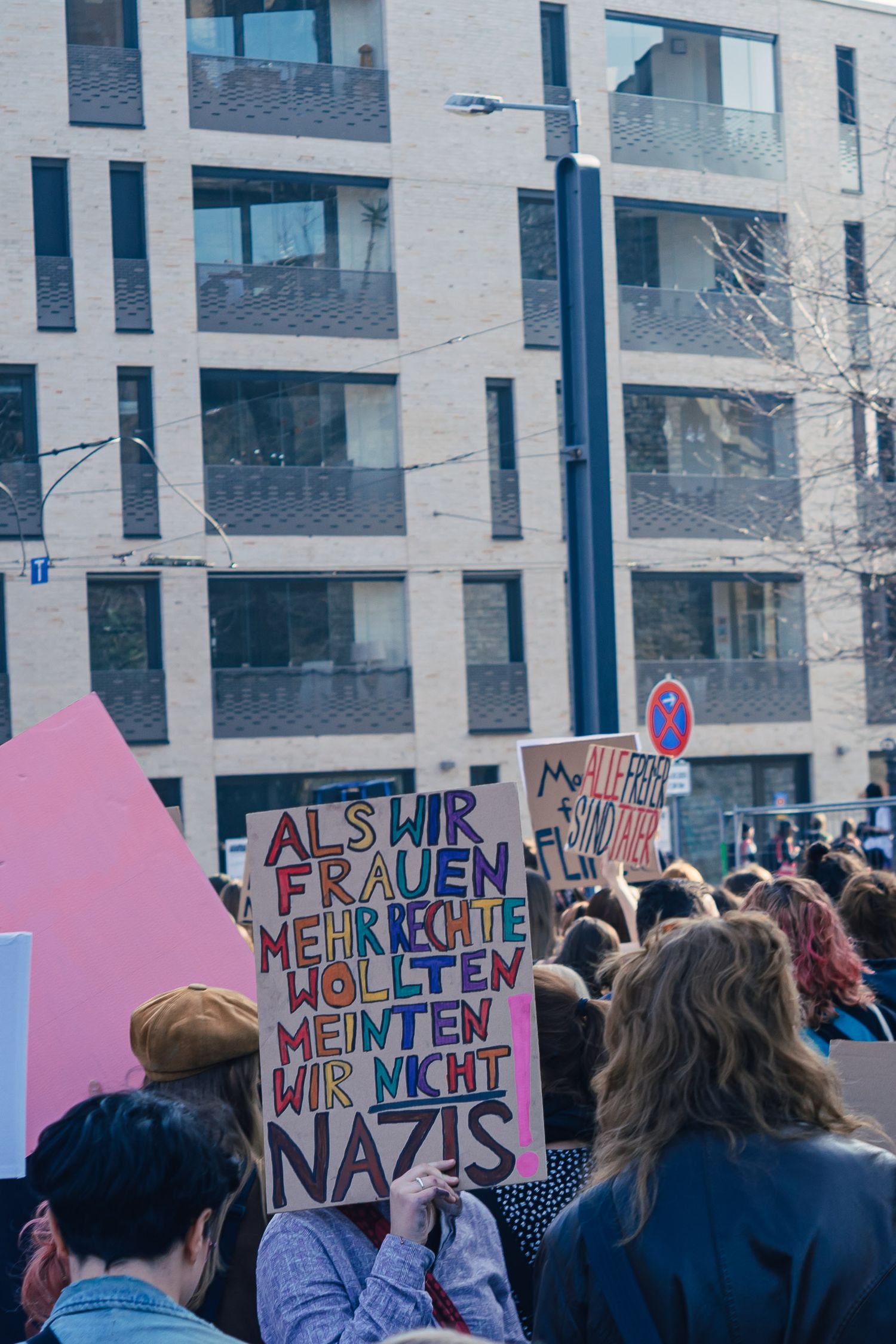 Protest scene at Erfurt. A group of demonstrators holding signs with messages about Feminism.