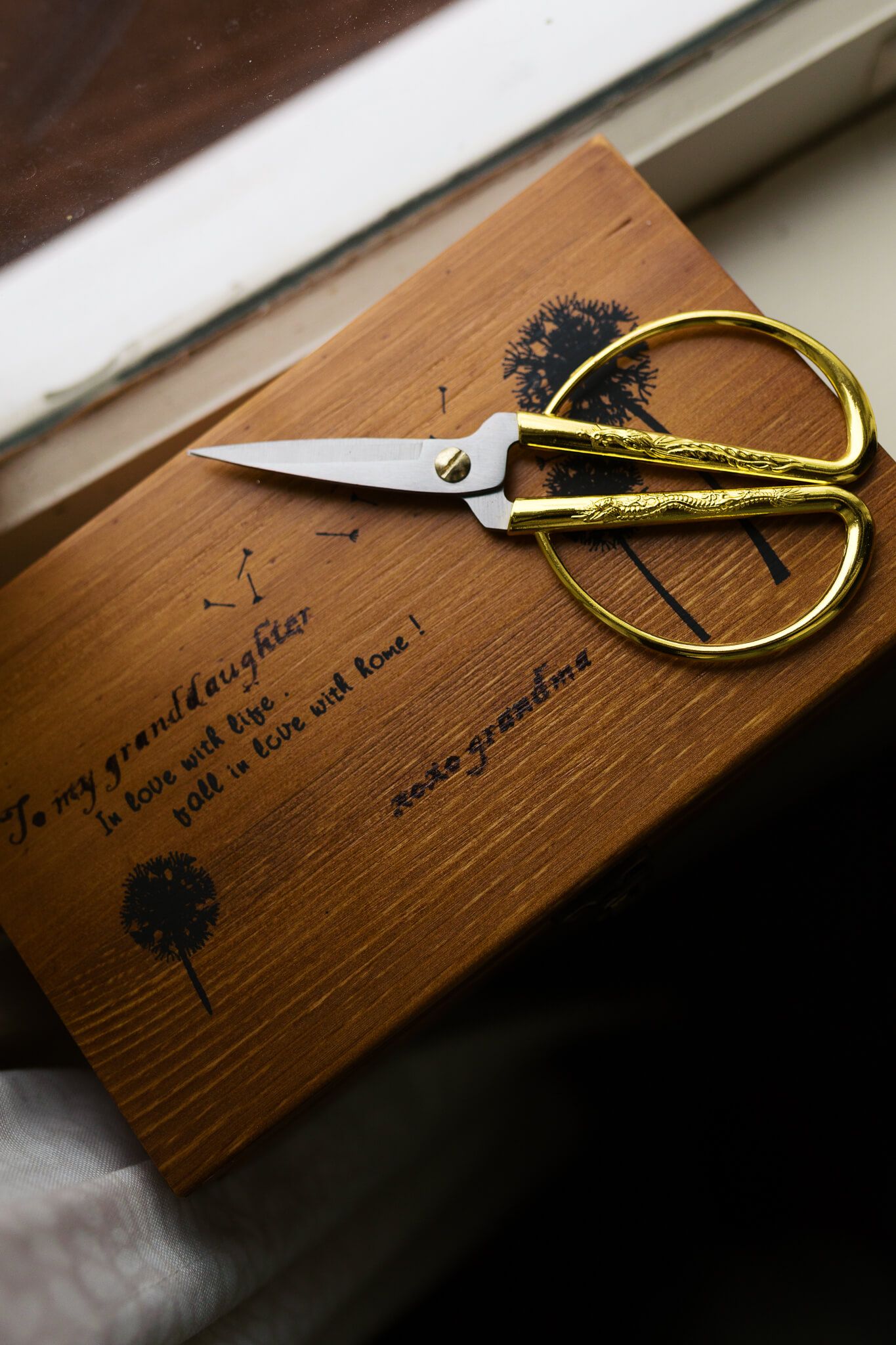 sewing box gift from grandma to granddaughter on her wedding day with gold sewing scissors sitting on top