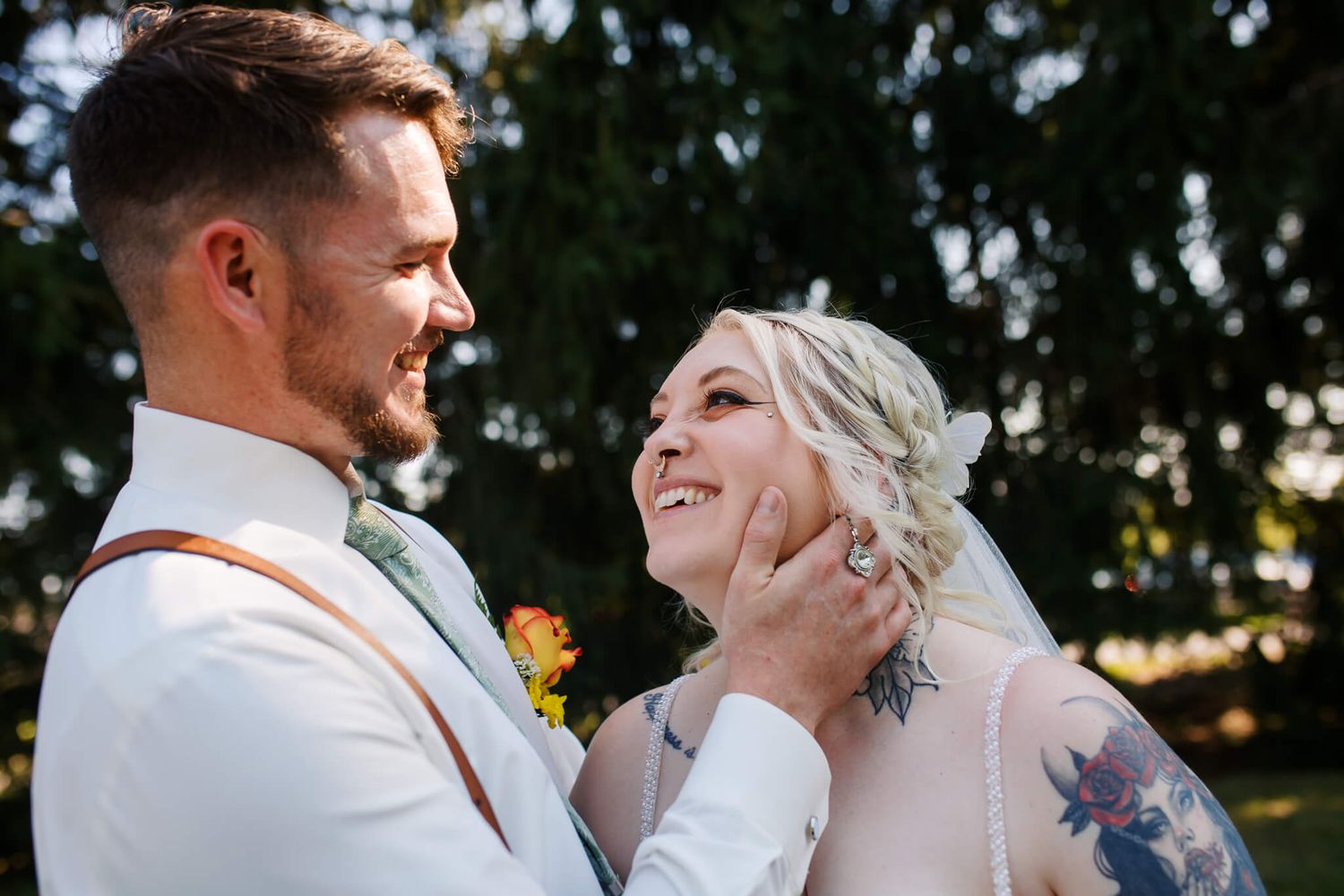 Bride and groom smiling joyfully at each other during bridal portraits taken by wedding photographer, Emma Craven