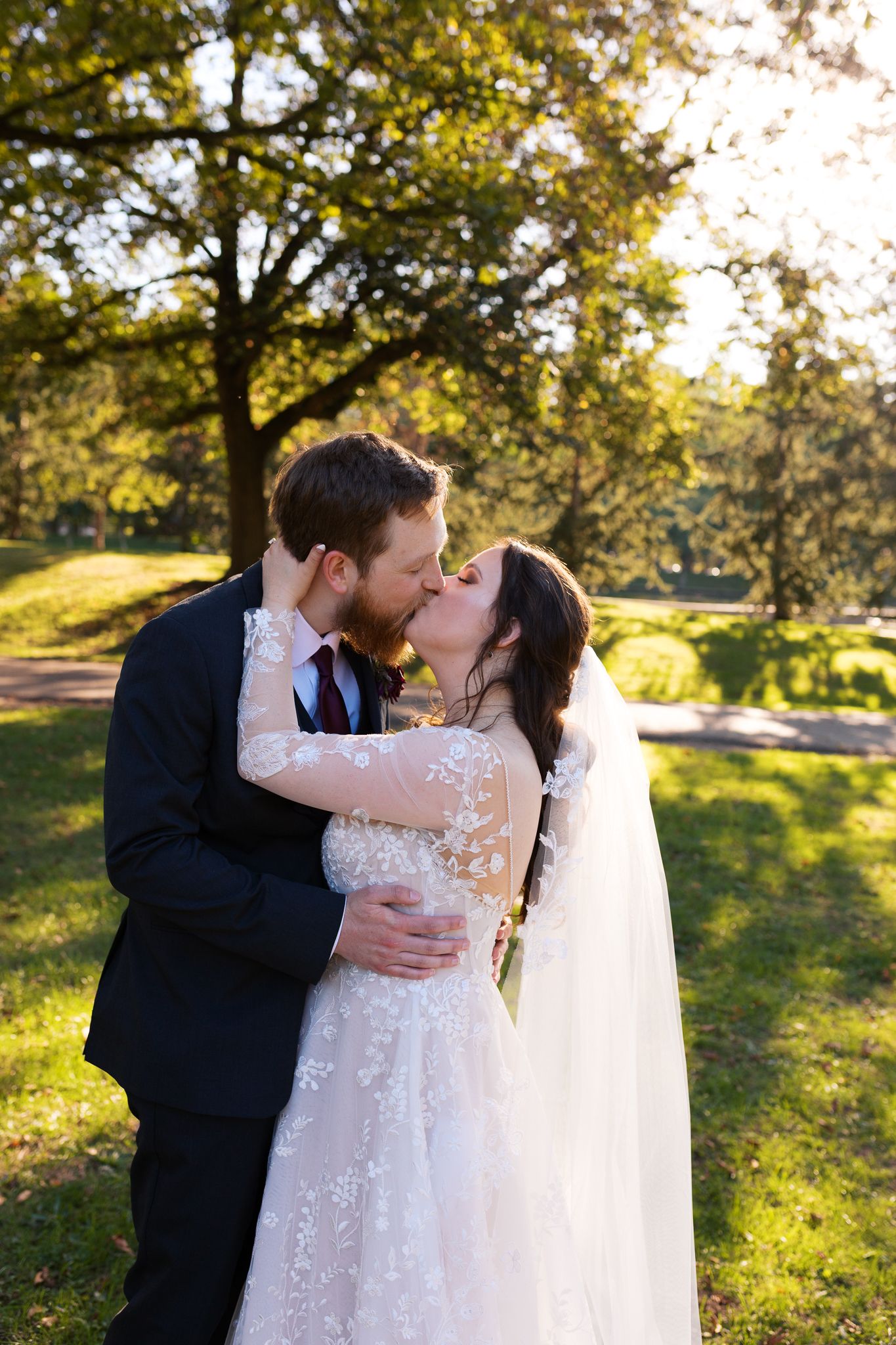 Bride and groom kissing during a beautiful sunset session at The National Aviary in Pittsburgh, PA