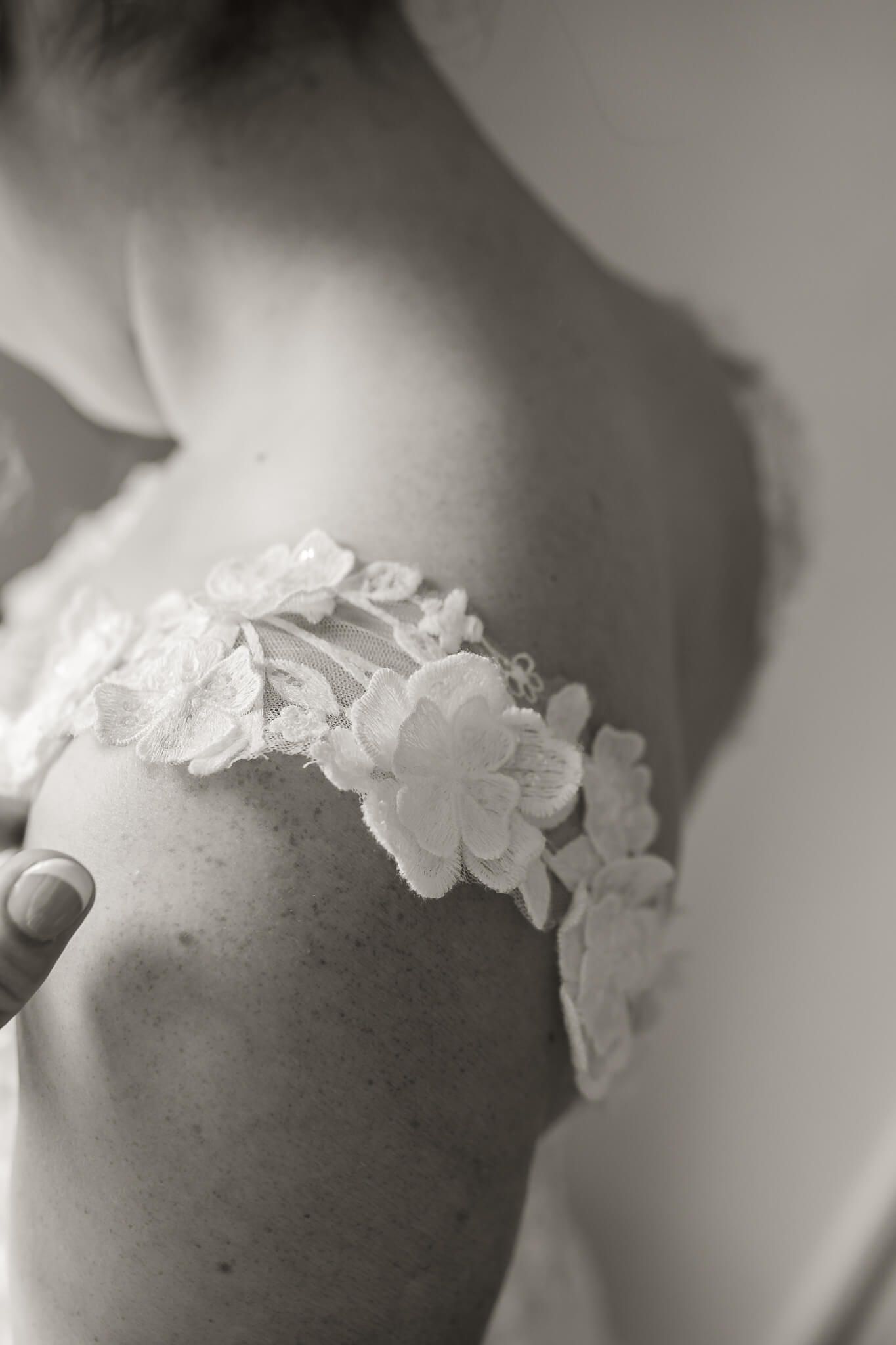 lace floral detail on shoulder of wedding dress