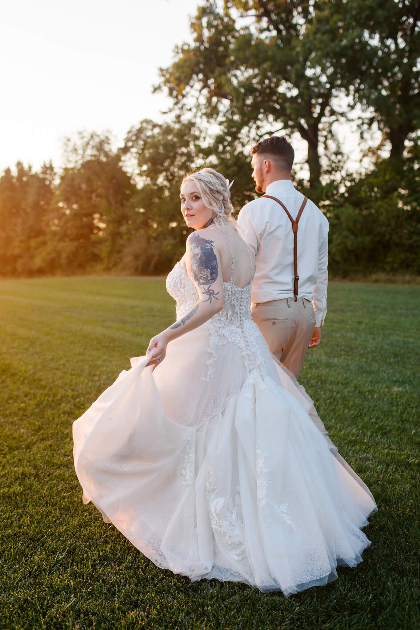 Bride and groom walk into sunset at Pinehall at Eisler Farms Wedding venue in Western Pennsylvania