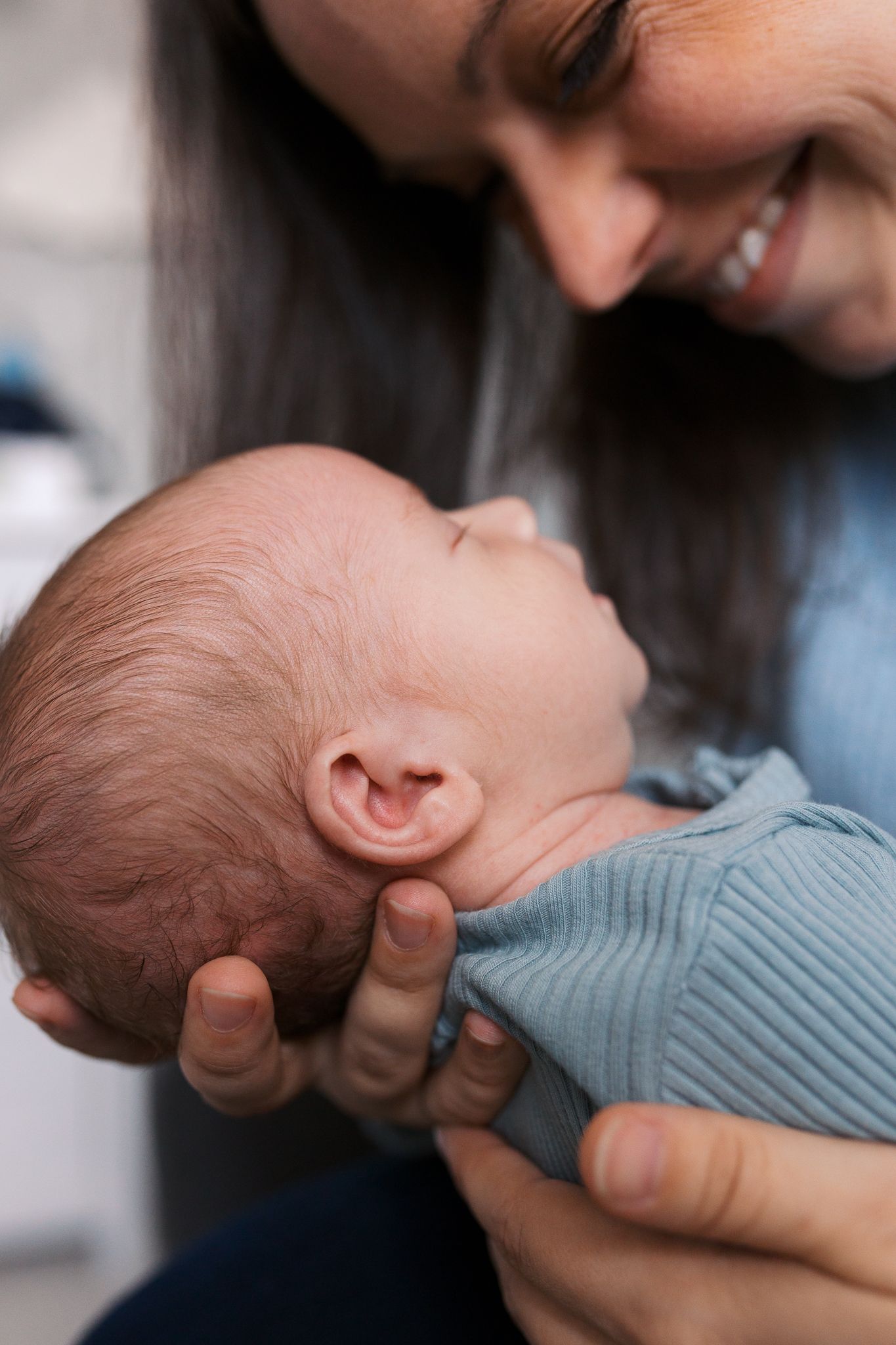 close up detail shot of baby boy ear and hair during in home newborn session