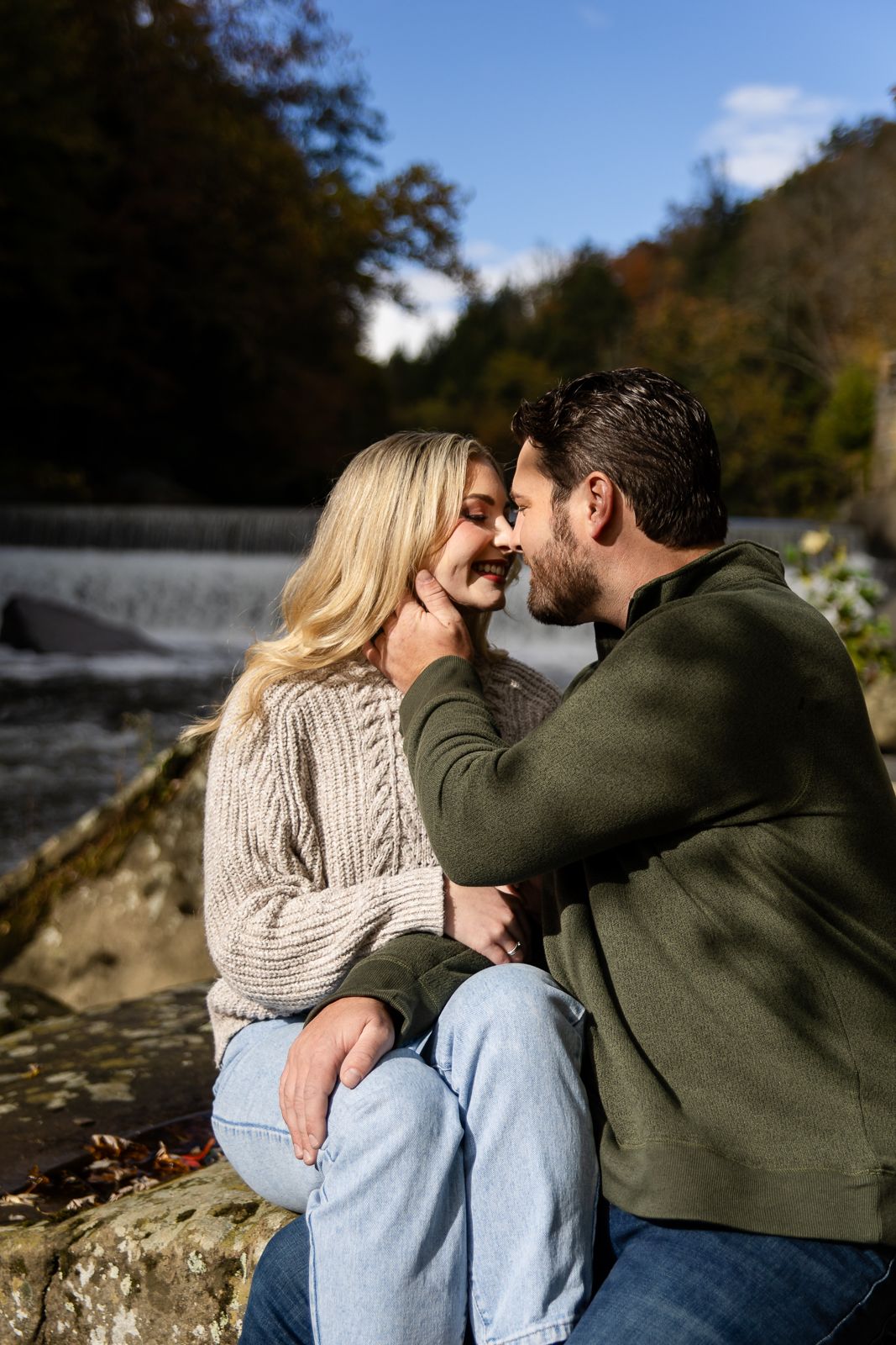 blonde woman and brunette man share a nose nuzzle