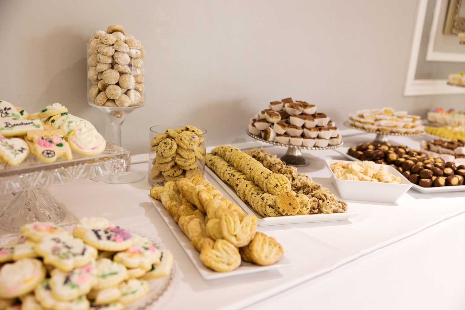 heart cookies, chocolate chip cookies in the foreground with layered cookies in the background