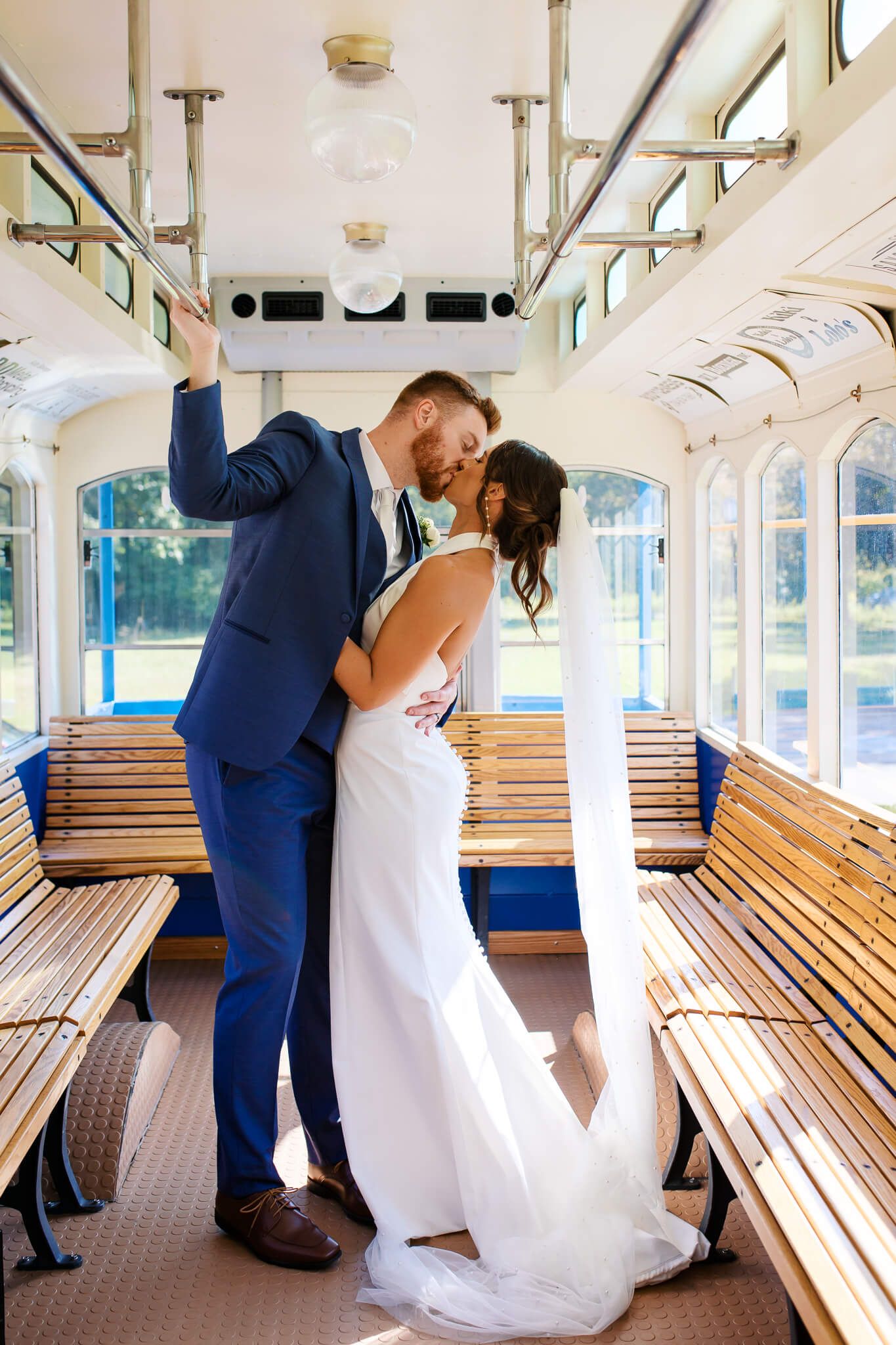 Bride and groom share a kiss after their wedding in Sarver, Pennsylvania