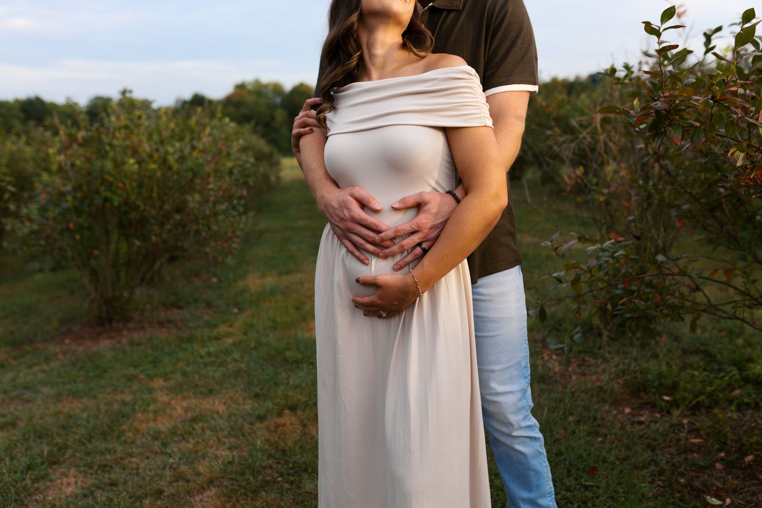 Mom and Dad hands on belly taken by Western Pennsylvania Maternity and Announcement Session Photographer Emma Craven