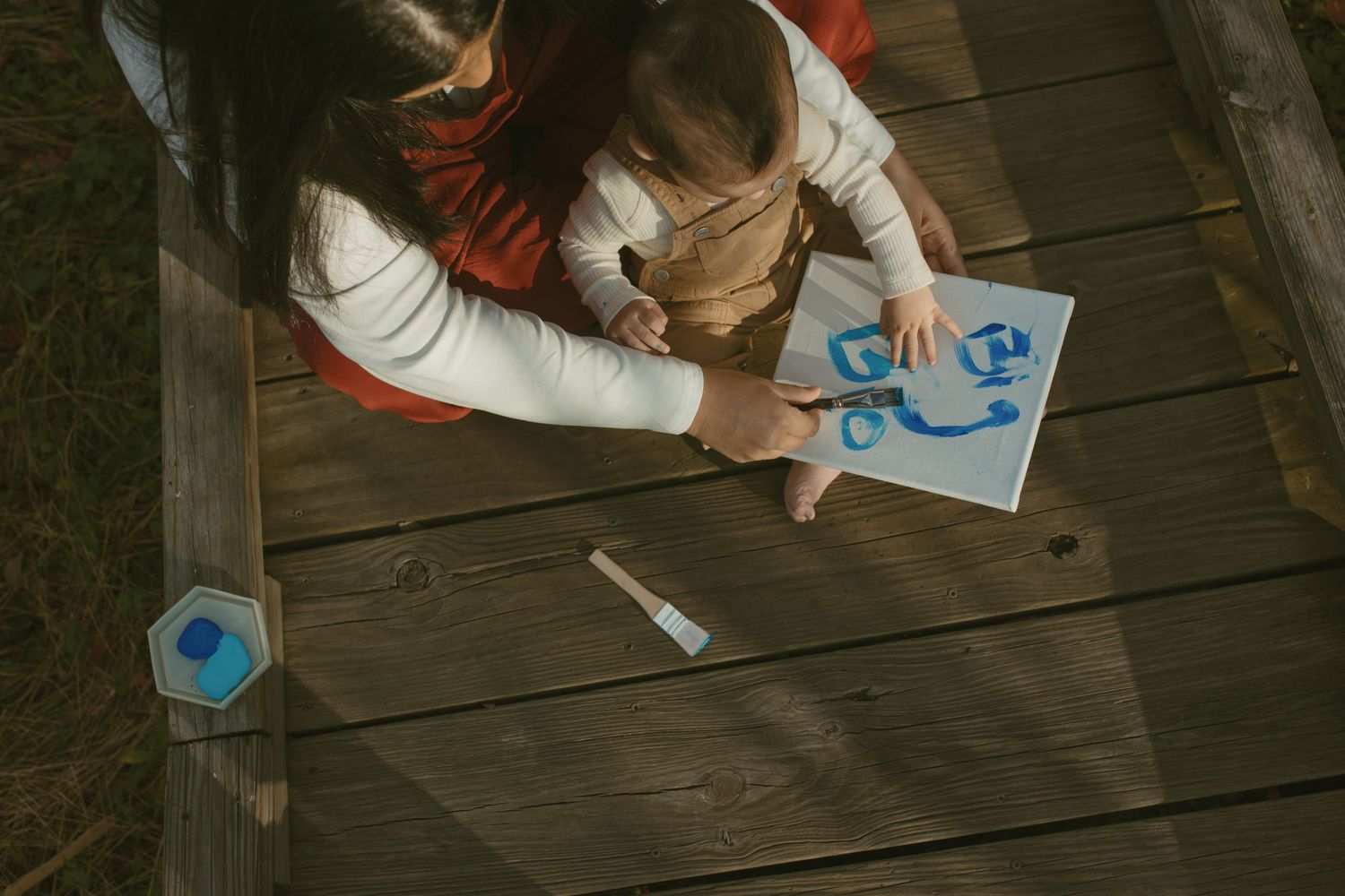 A motherhood photo session of a mom painting with her toddler in Sussex County, New Jersey.