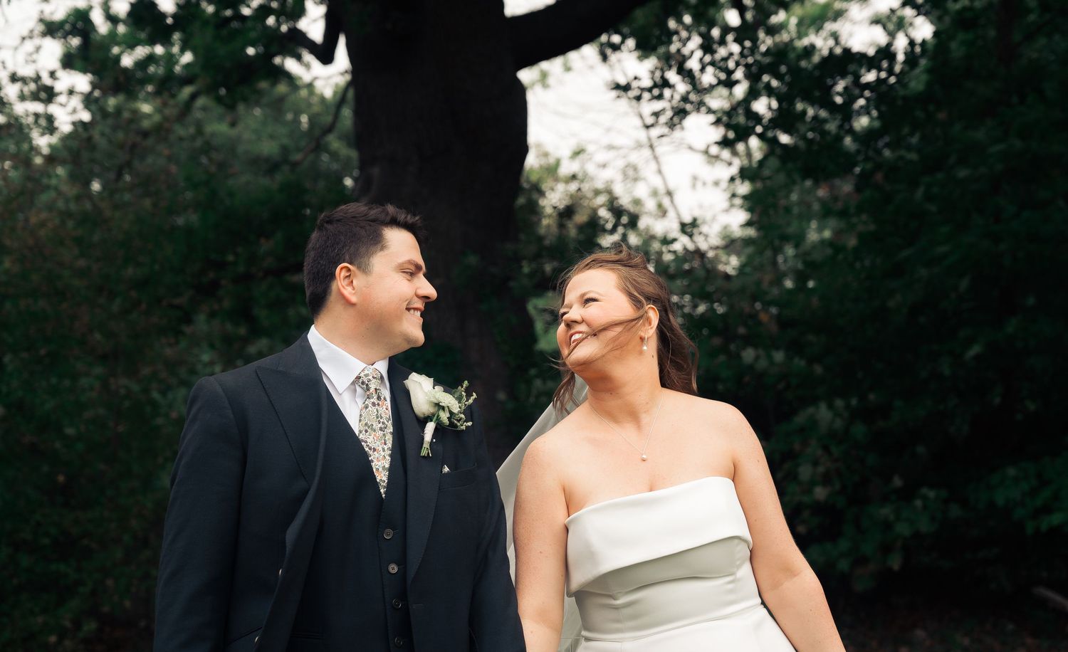 photo of couple just married looking into each others eyes.
