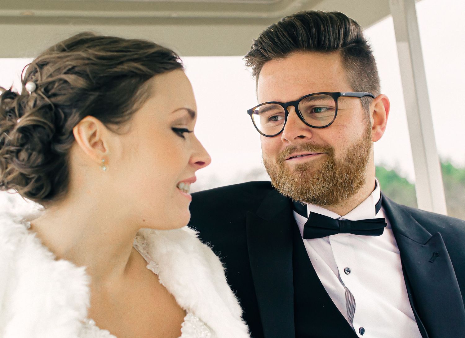 groom looking lovingly at his bride
