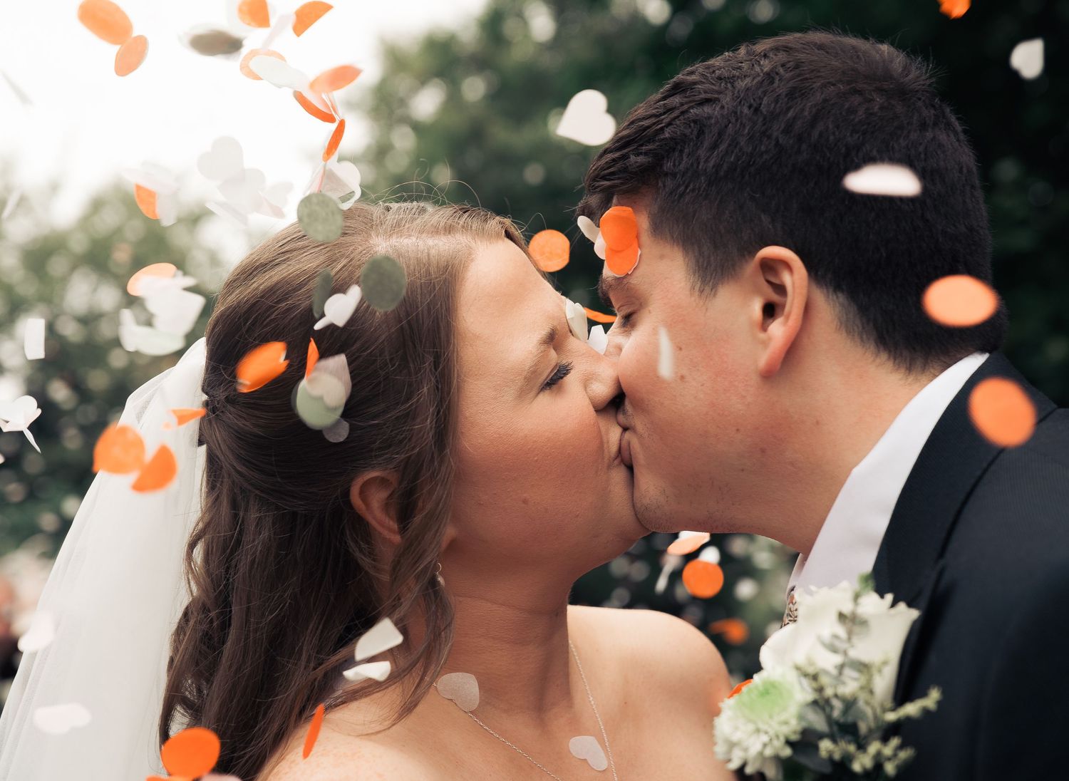 newly wed couple share a kiss after getting married