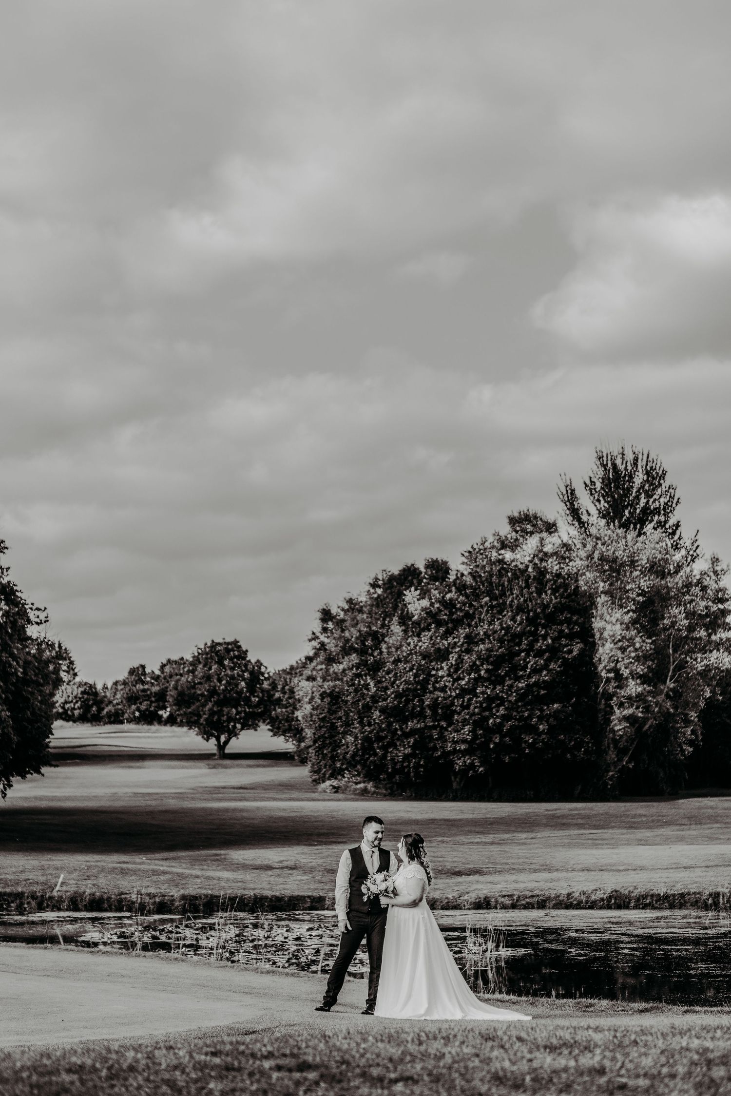 A quiet moment by the water at Wrag Barn, just taking in their day. I love capturing these pauses — the calm in between the celebrations |