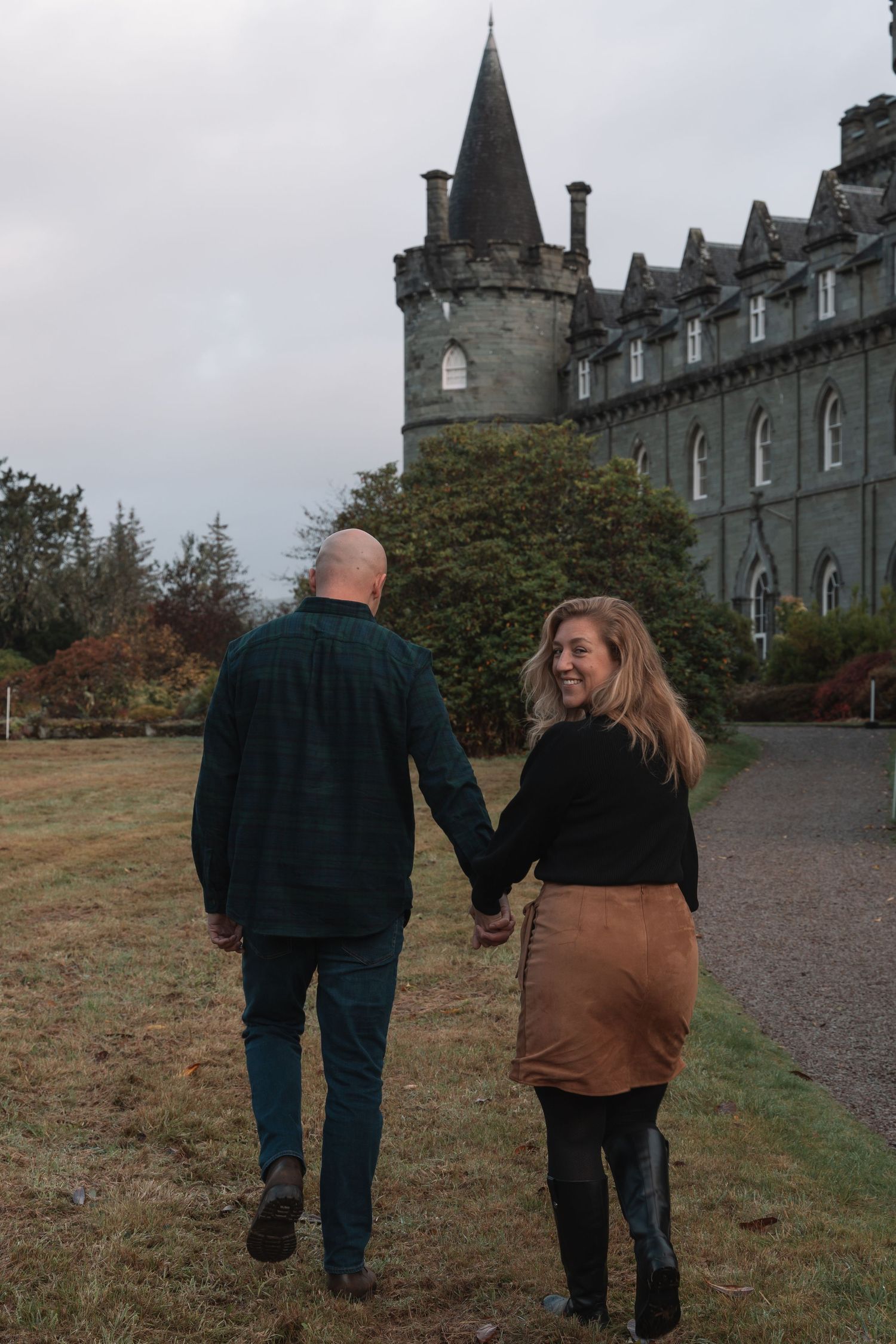 Romantic couple posing in front of Inveraray Castle
Couple embracing in castle gardens
