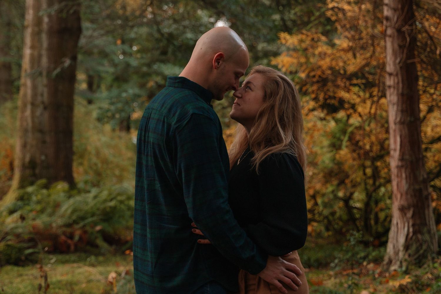Couple embracing in castle gardens