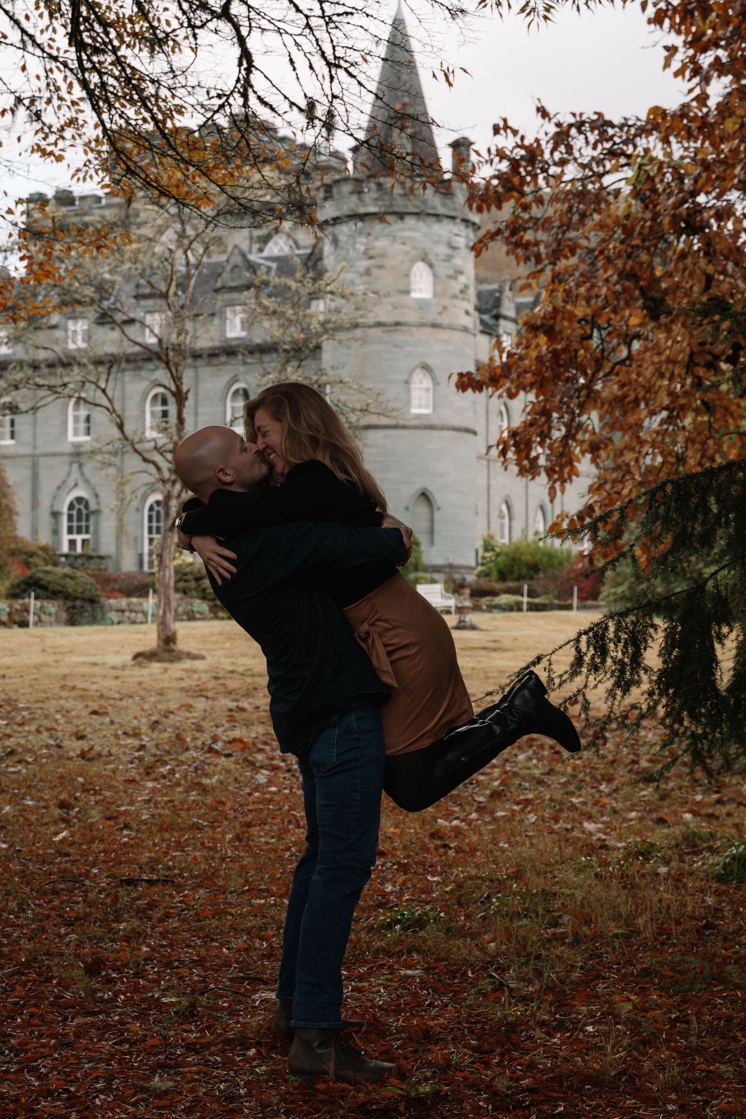 Candid moment during engagement session at Inveraray Castle