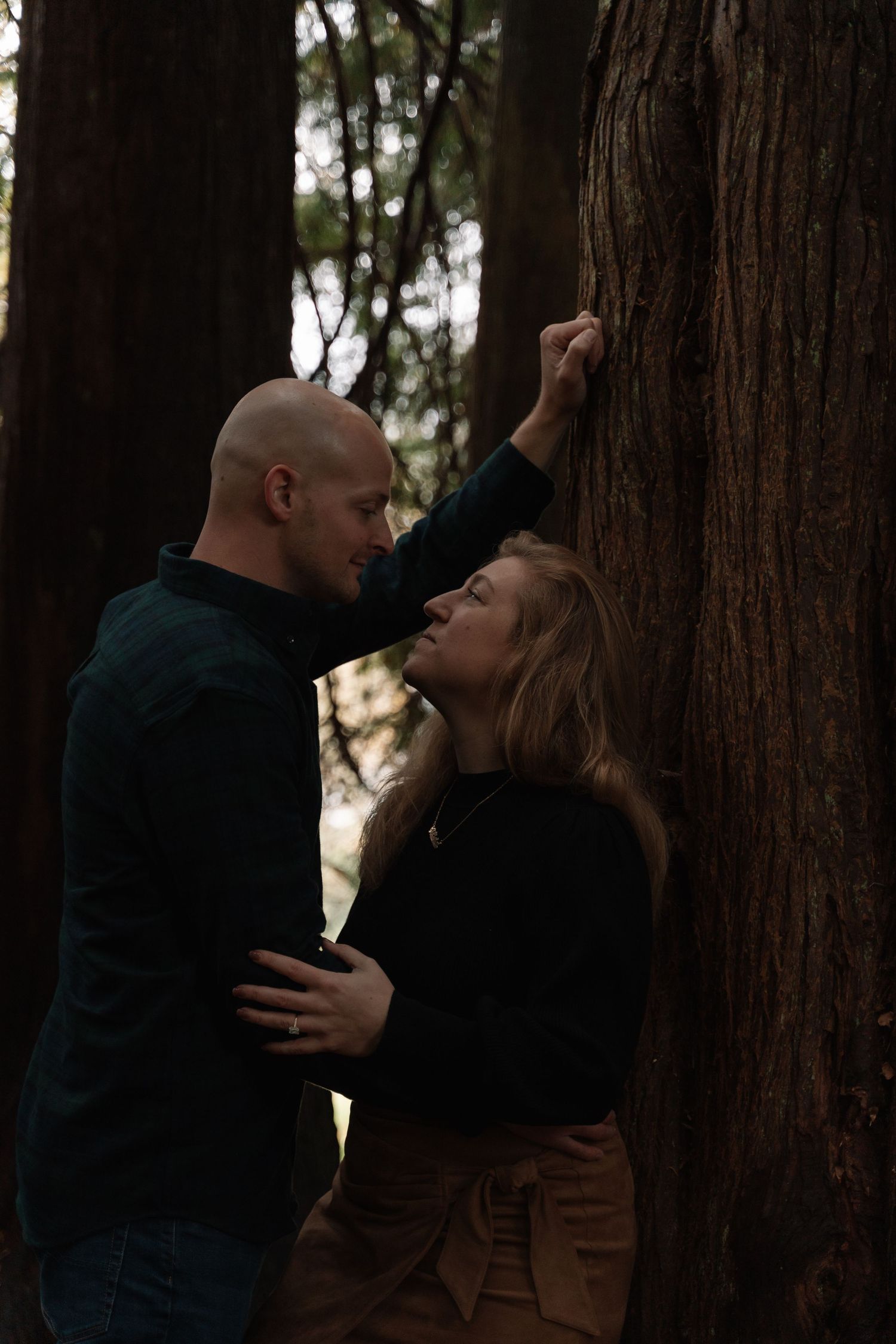 Couple embracing in castle gardens