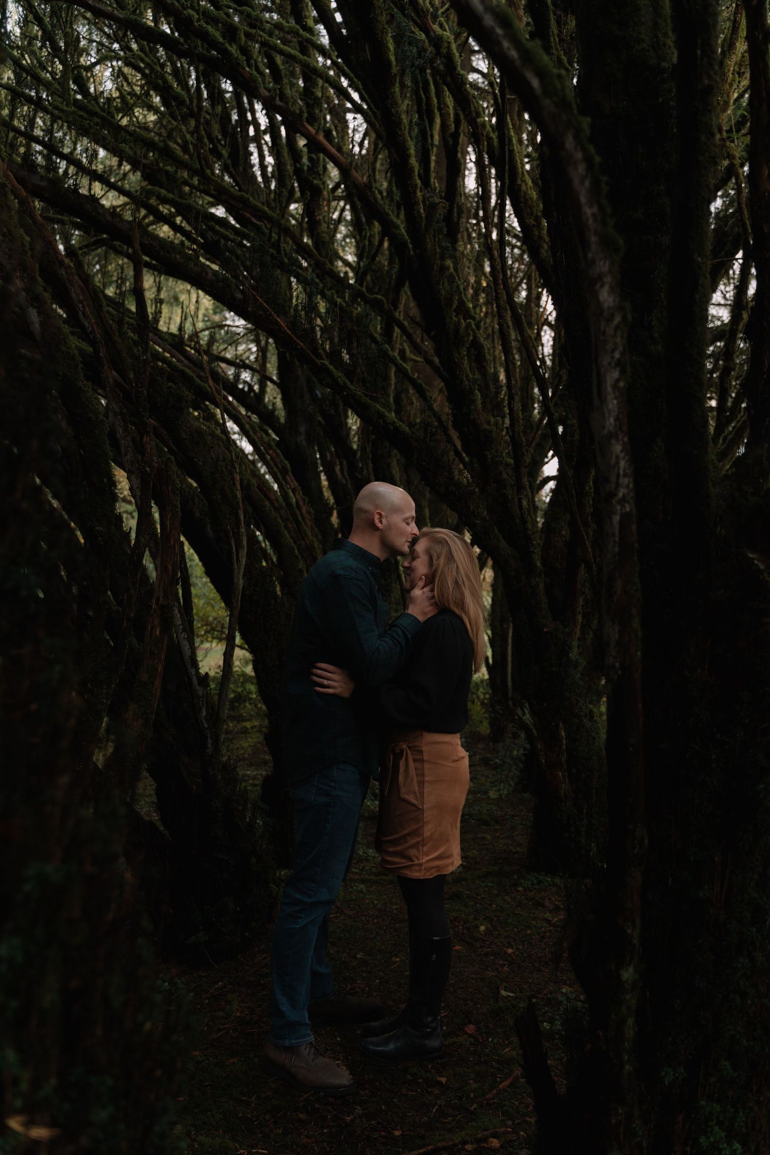 Couple embracing in castle gardens