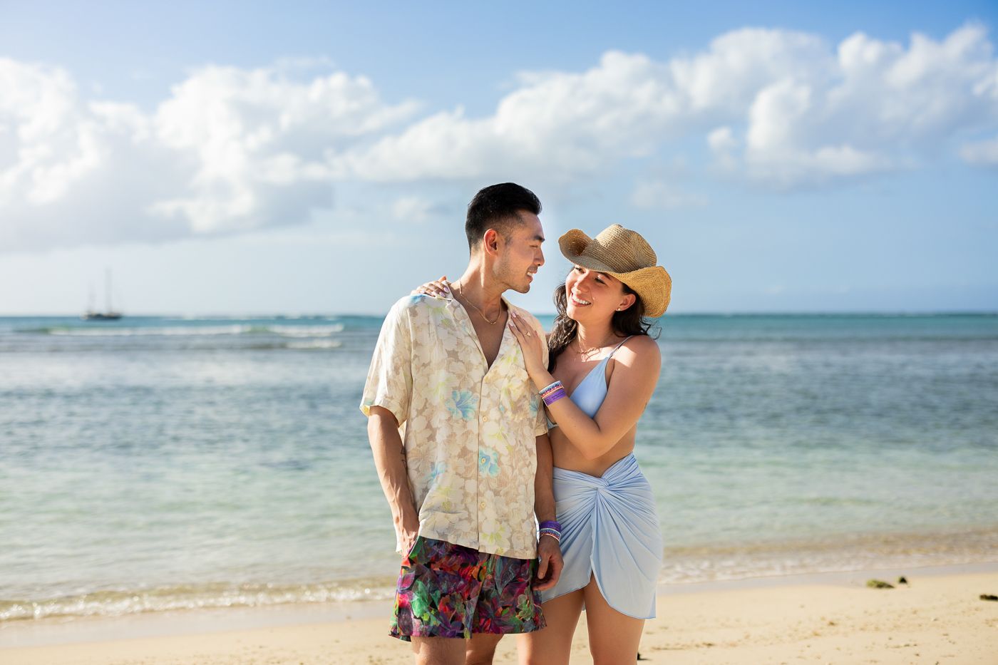 Beautiful beach engagement session with turquoise waters and white sand beach.
