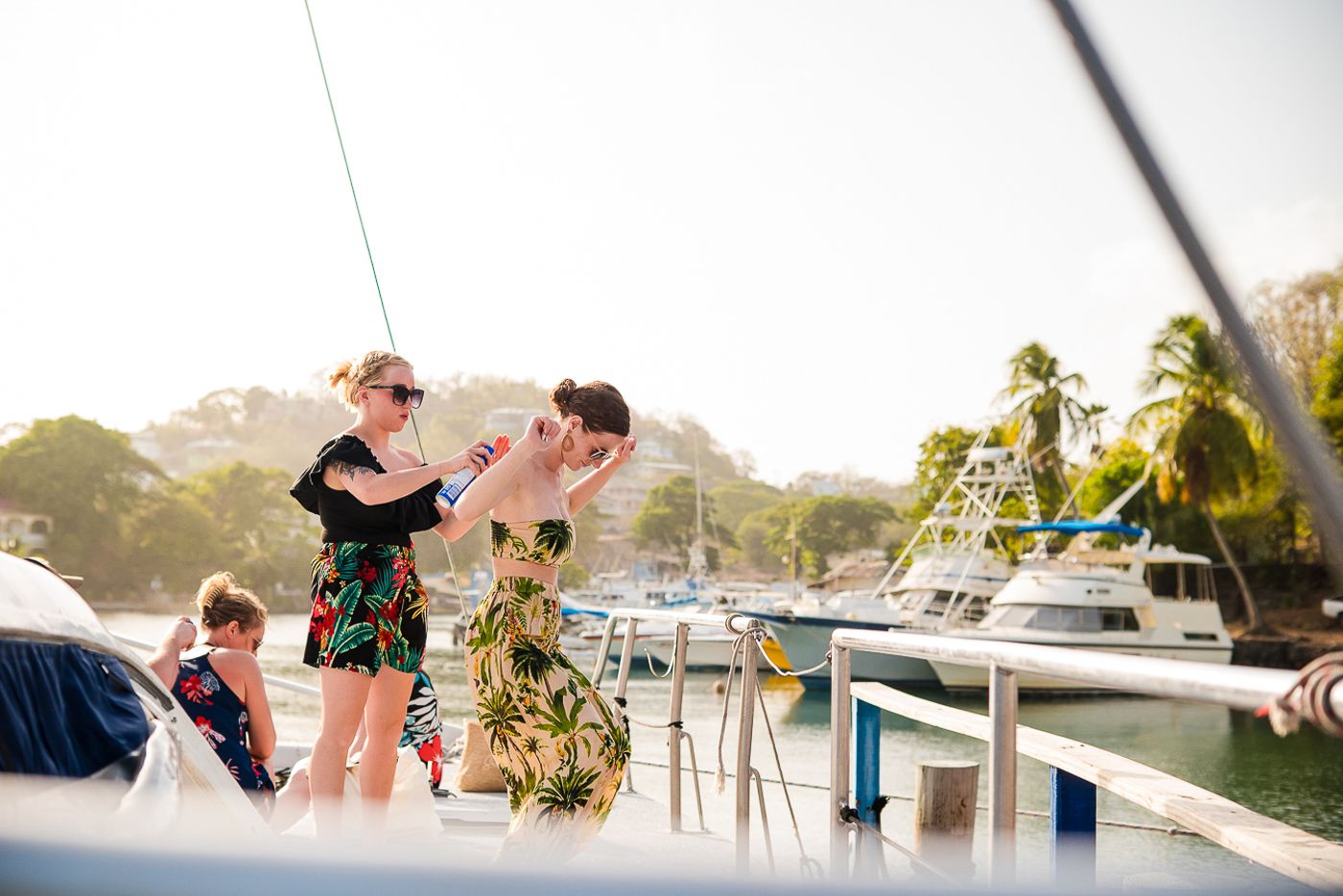 Guests enjoying a sunny afternoon on a catamaran sailing trip.