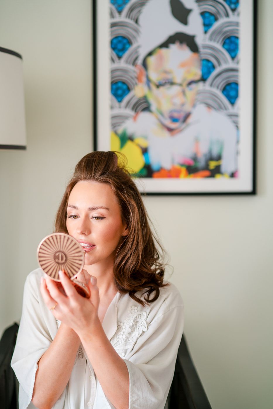 Series of candid moments in front of wall art with blue geometric patterns.