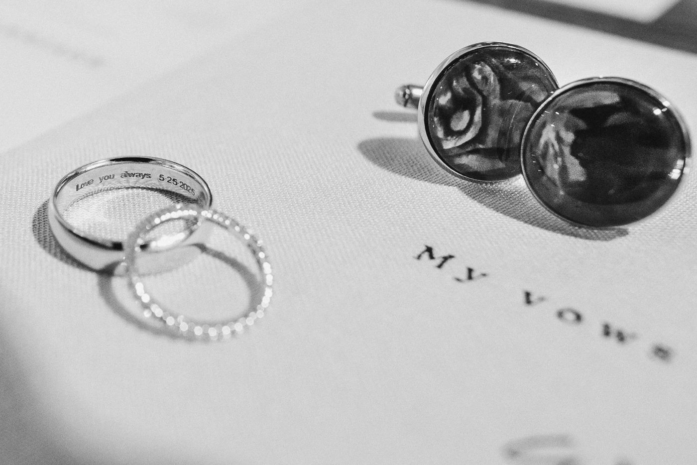 A collection of elegant silver and diamond jewelry pieces including rings and earrings arranged in a row.