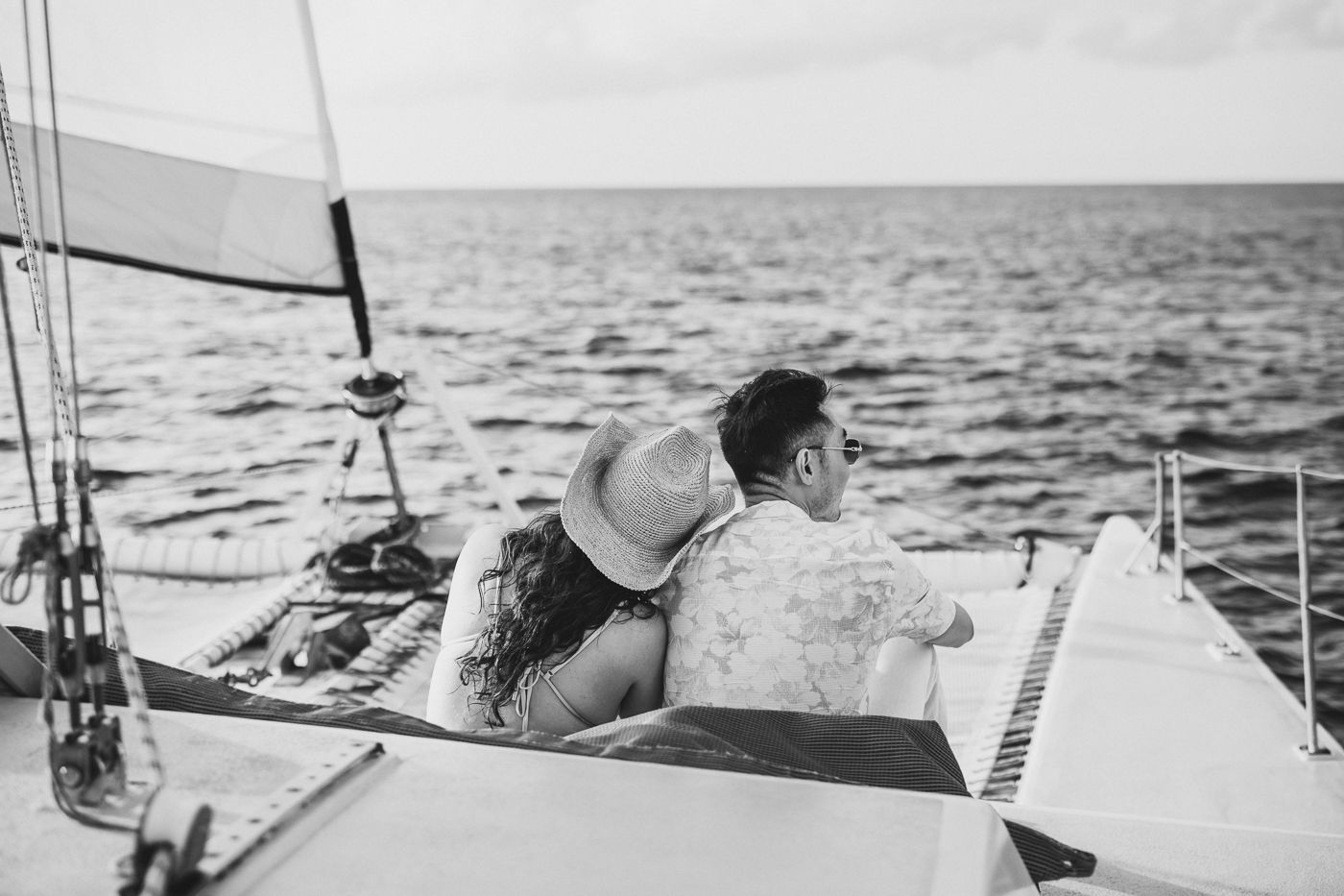 Black and white nautical photographs taken aboard a sailboat on the ocean.